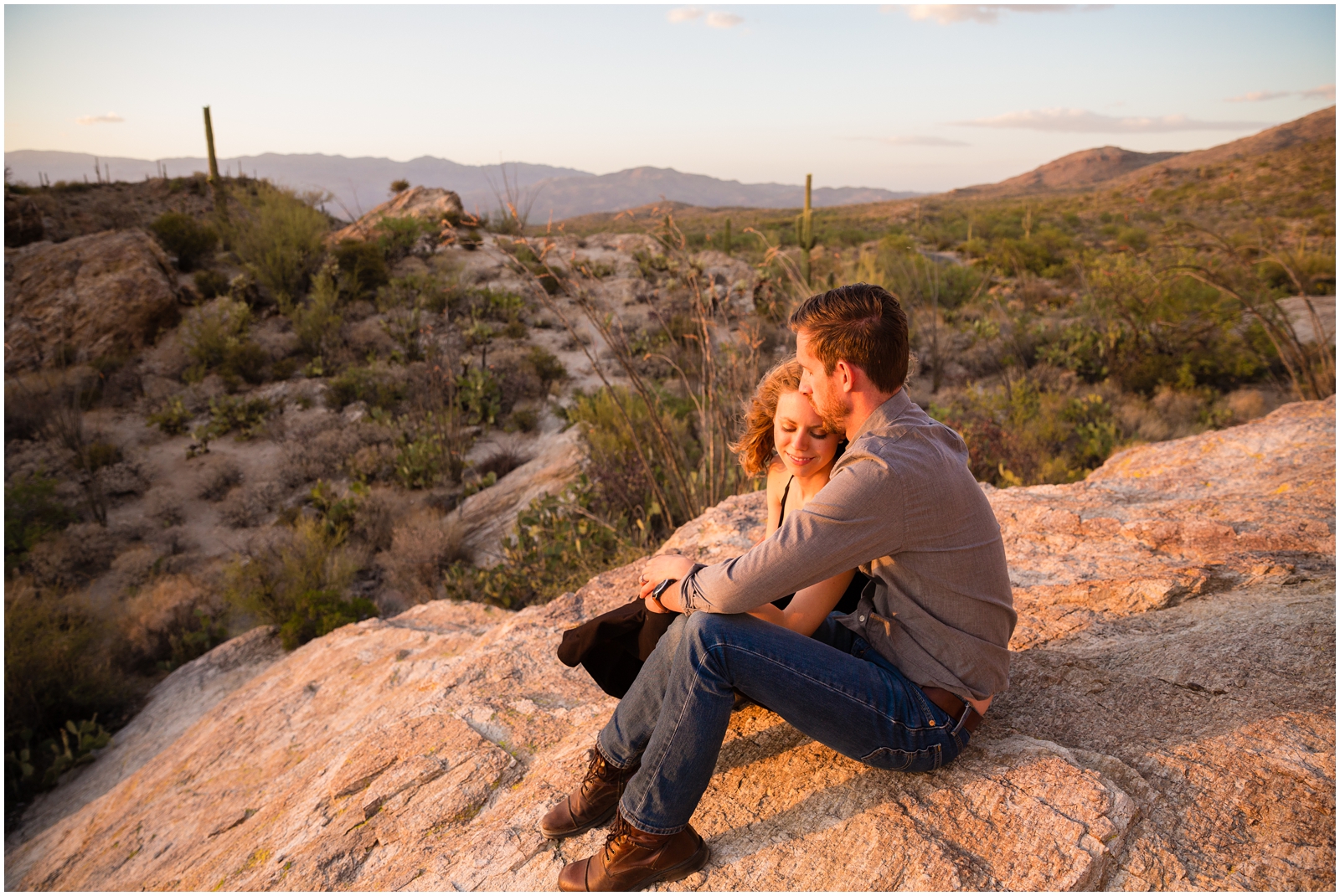 This couple cuddles at sunset in Saguaro National Park | Clarissa Wylde Photography