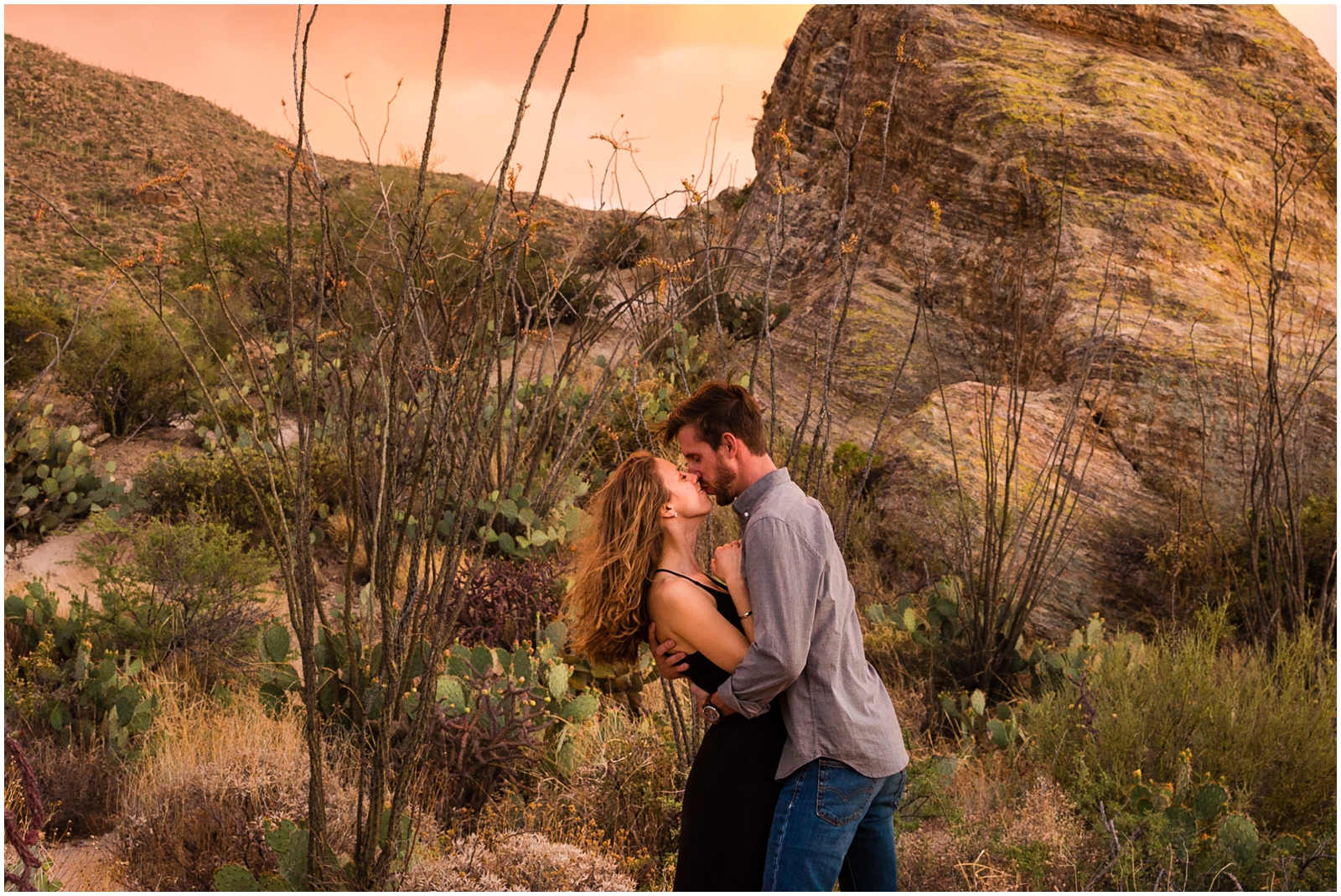 This couple kissing under a famous Arizona sunset in Saguaro National Park | Clarissa Wylde Photography