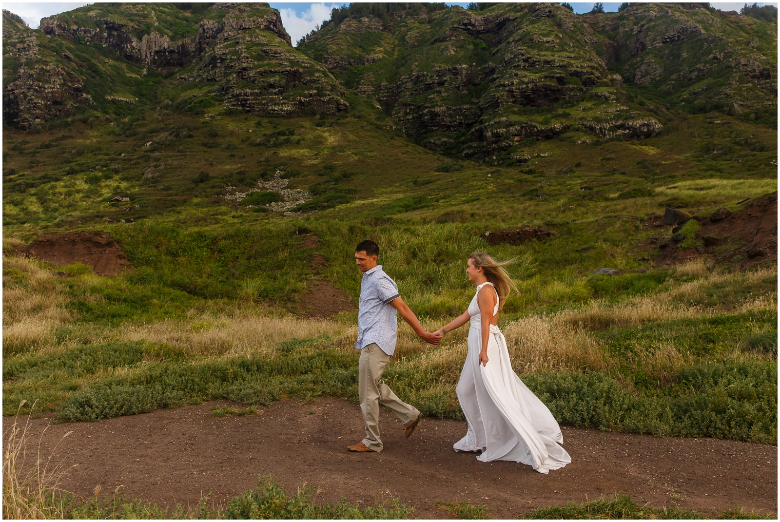 Couple running during their destination Oahu elopement.