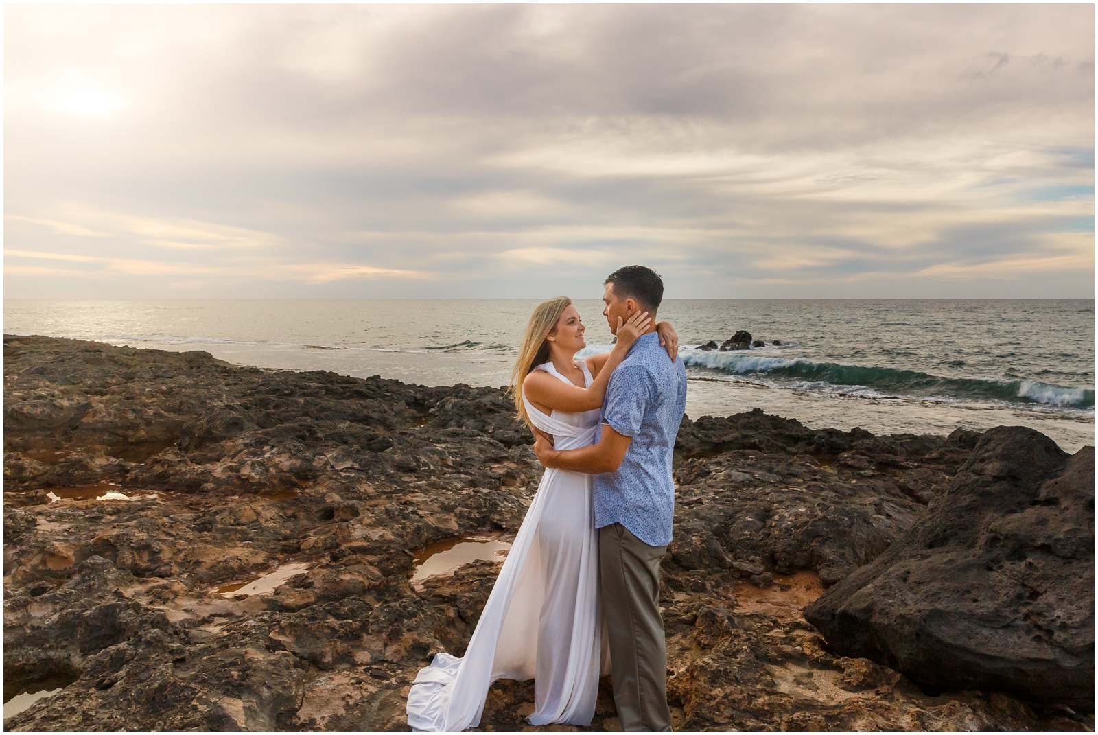 Sunset on the beach during this couple's Oahu elopement
