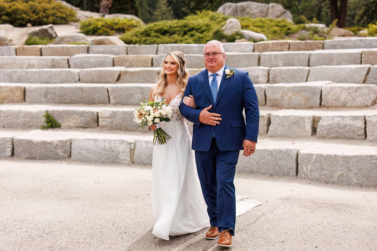 bride and father walking at glacier point amphitheater 