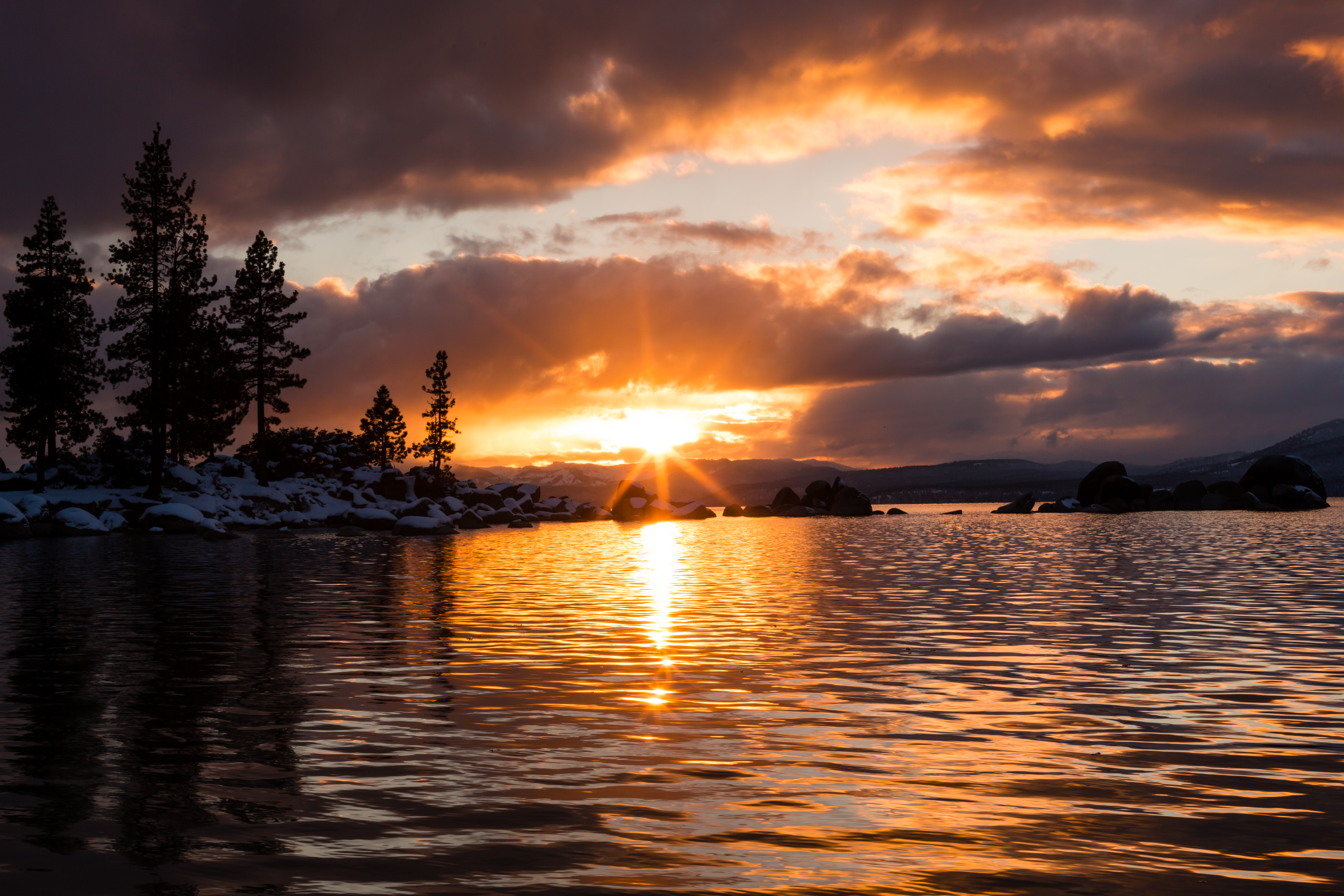 Sunset at Lake Tahoe's Sand Harbor beach in the winter.