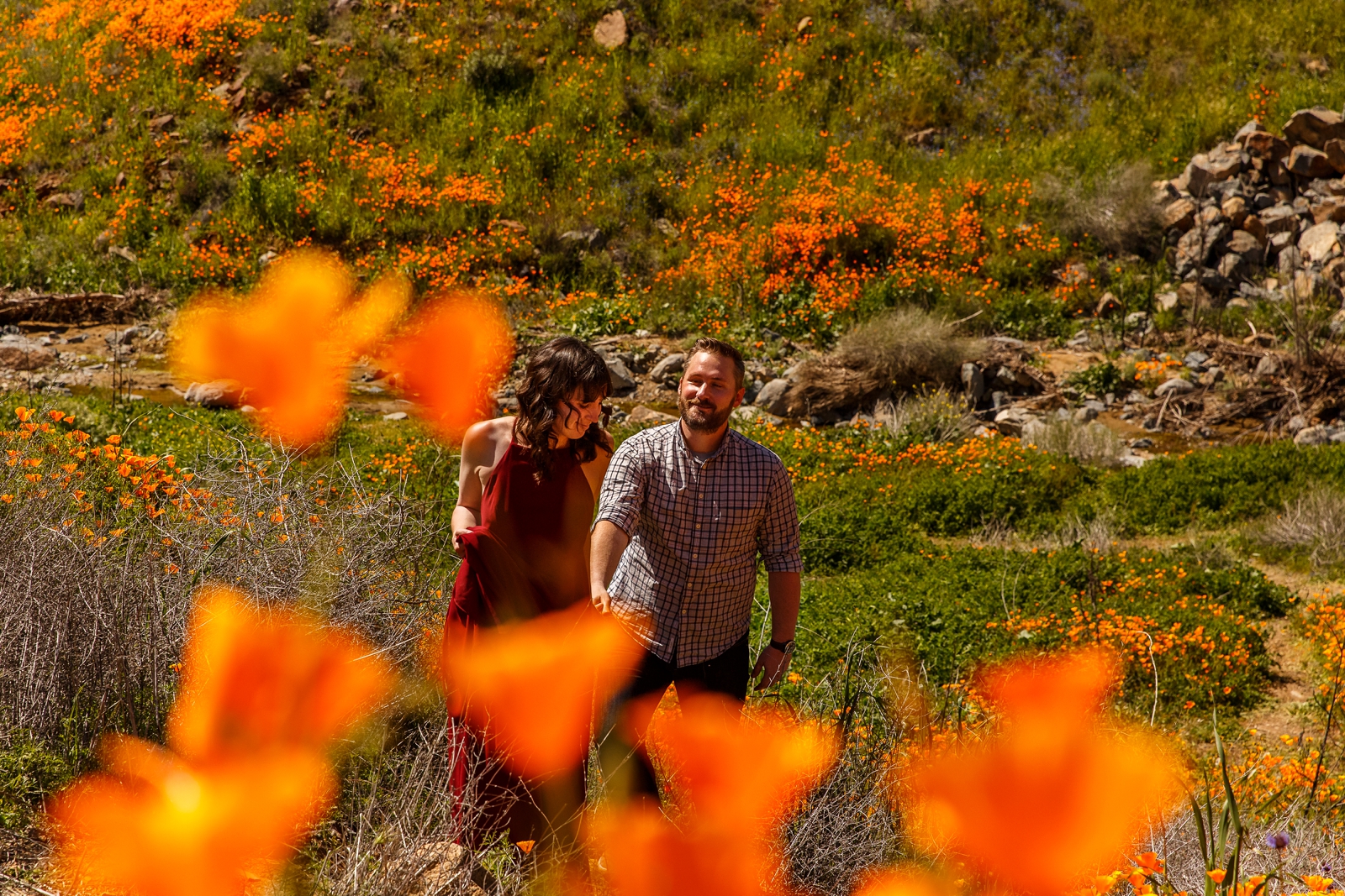 Couple hiking in wildflower fields