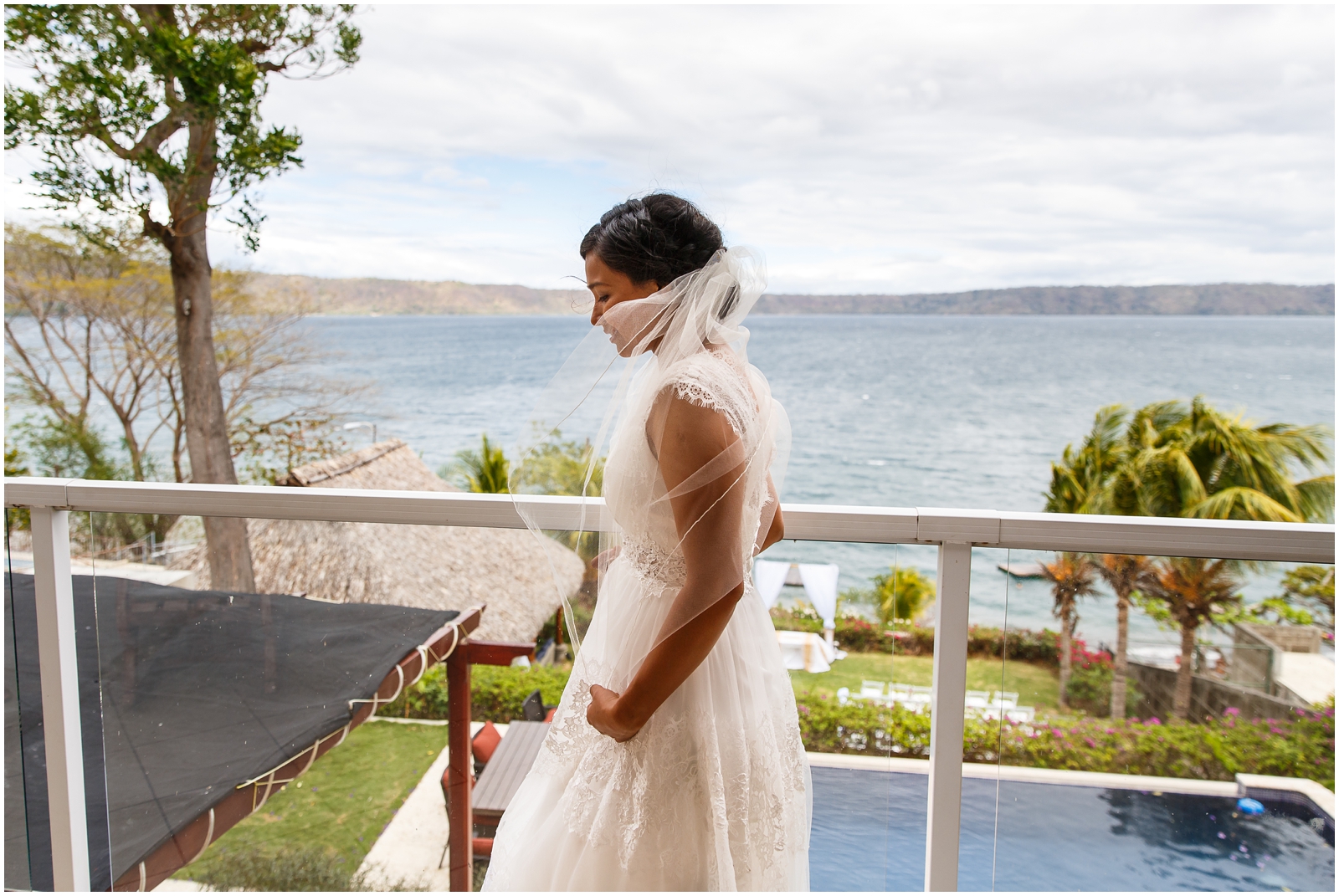 A bride overlooking the lake on her intimate wedding day.