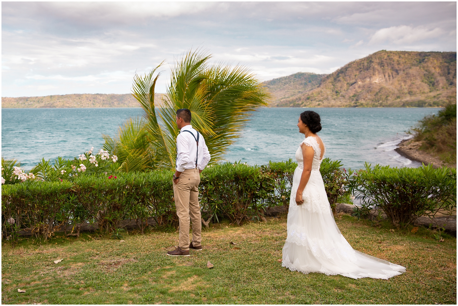 A couple's first look overlooking a Nicaraguan lake.