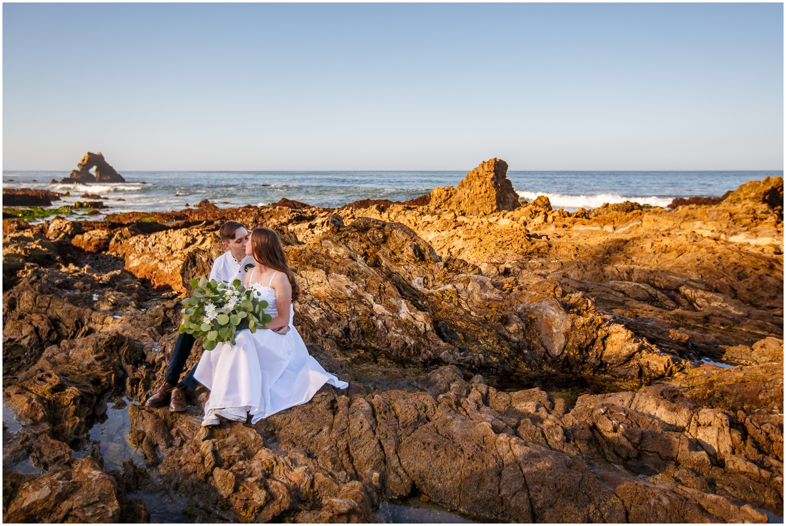 This couple explored the tidepools at Corona Del Mar on their wedding day.
