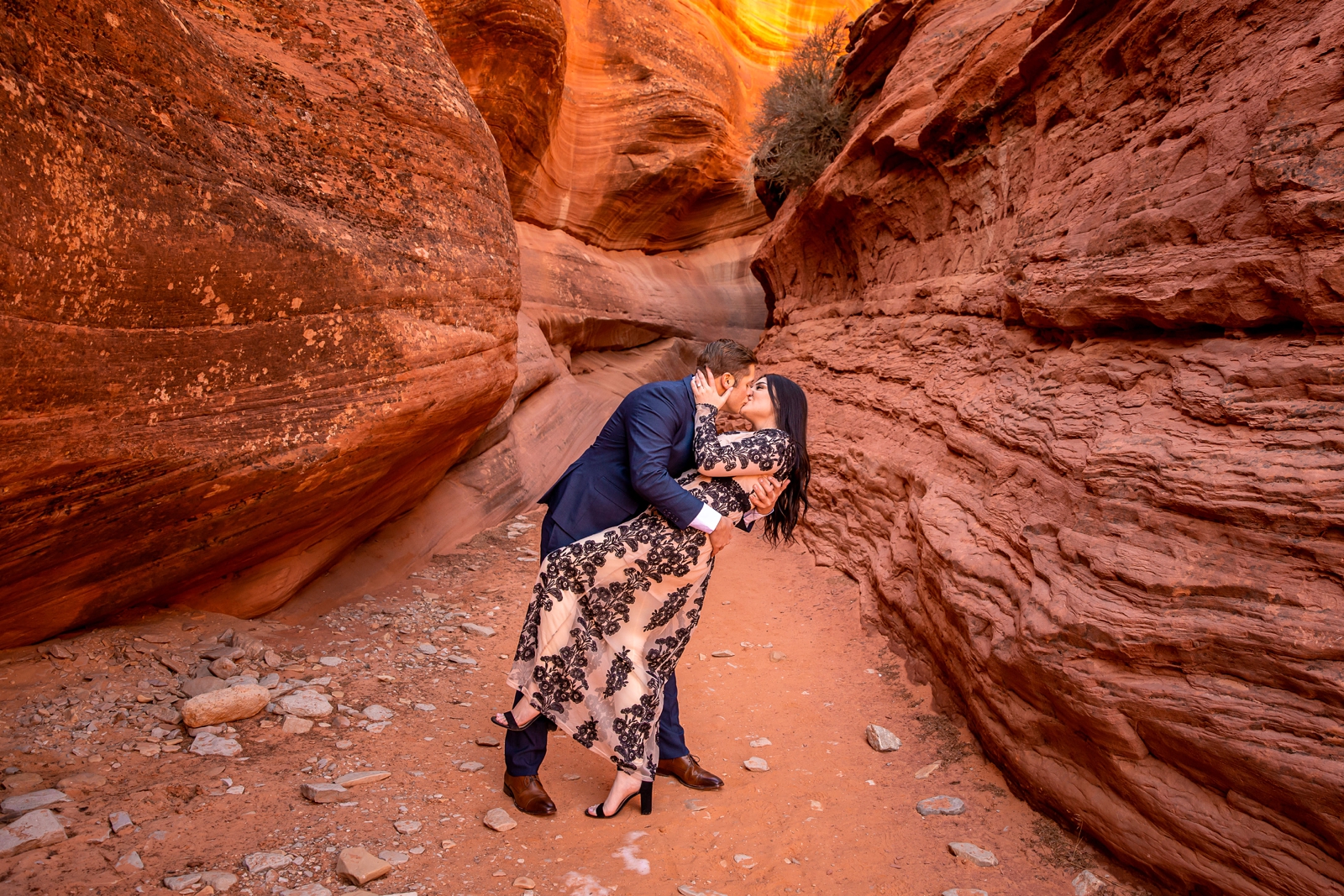 Passionate kissing couple in a Kanab Utah slot canyon.