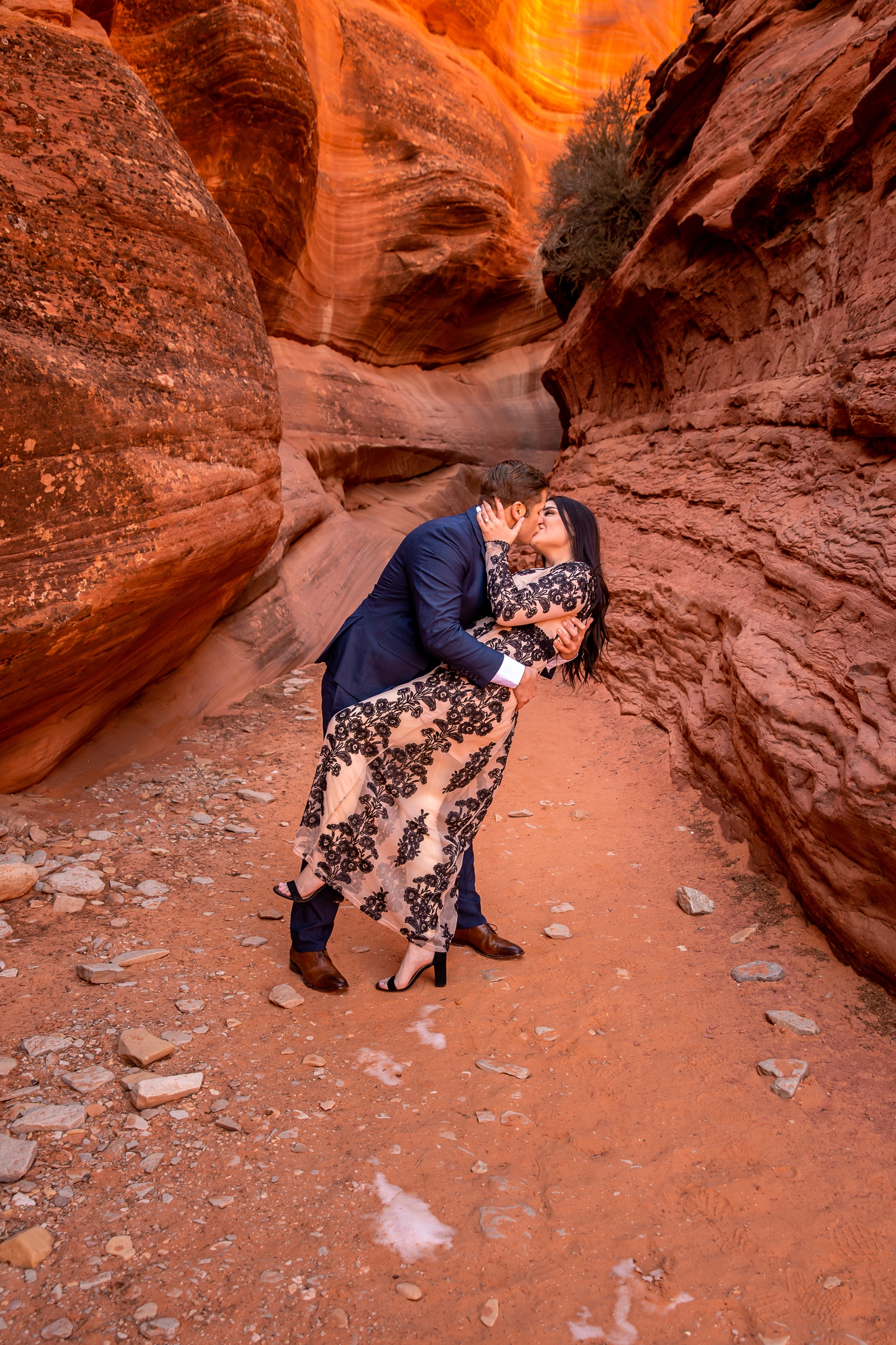 Passionate kissing couple in a Southern Utah slot canyon.