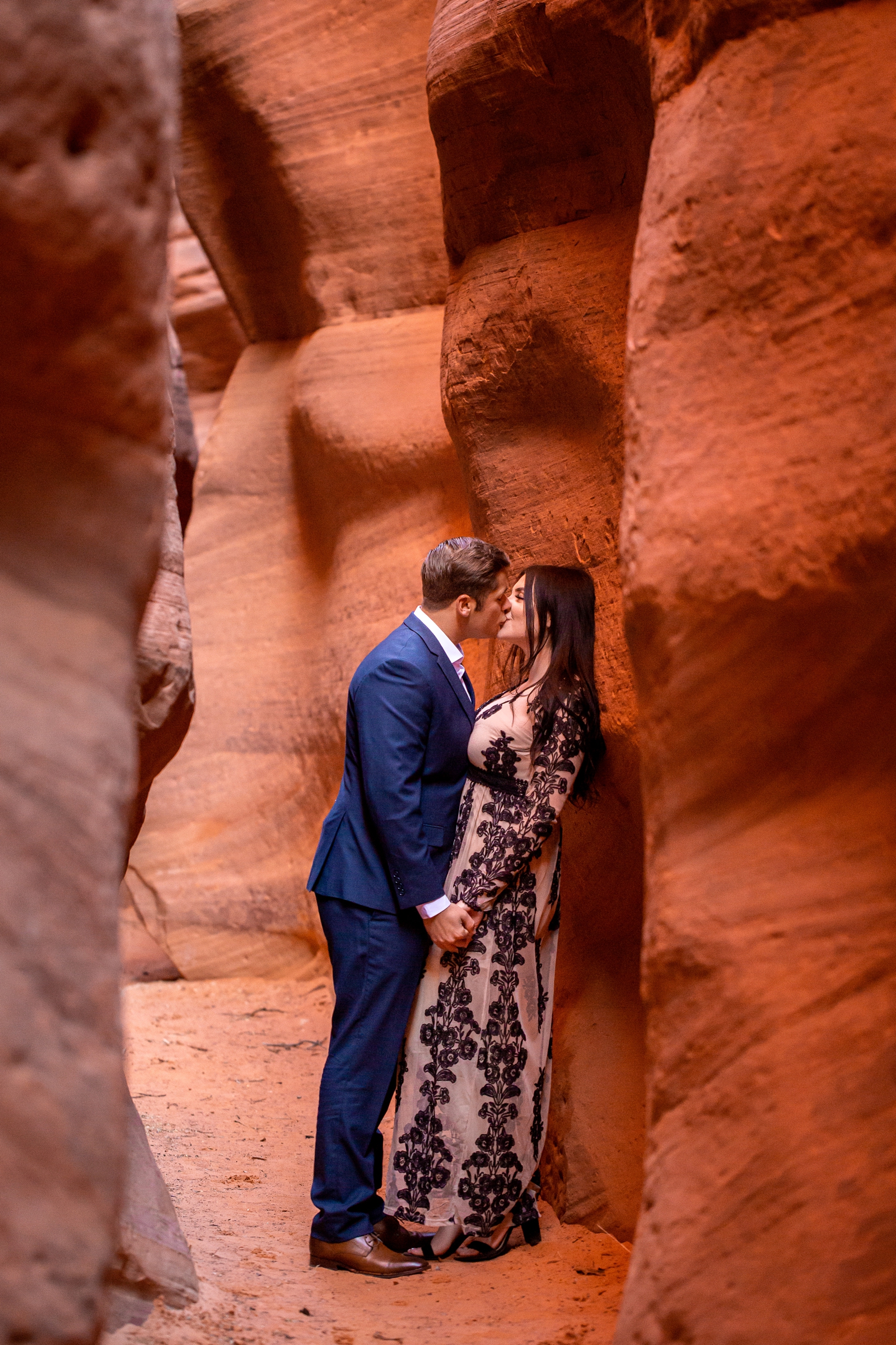 Dreamy couple kissing in a Kanab, Utah slot canyon.