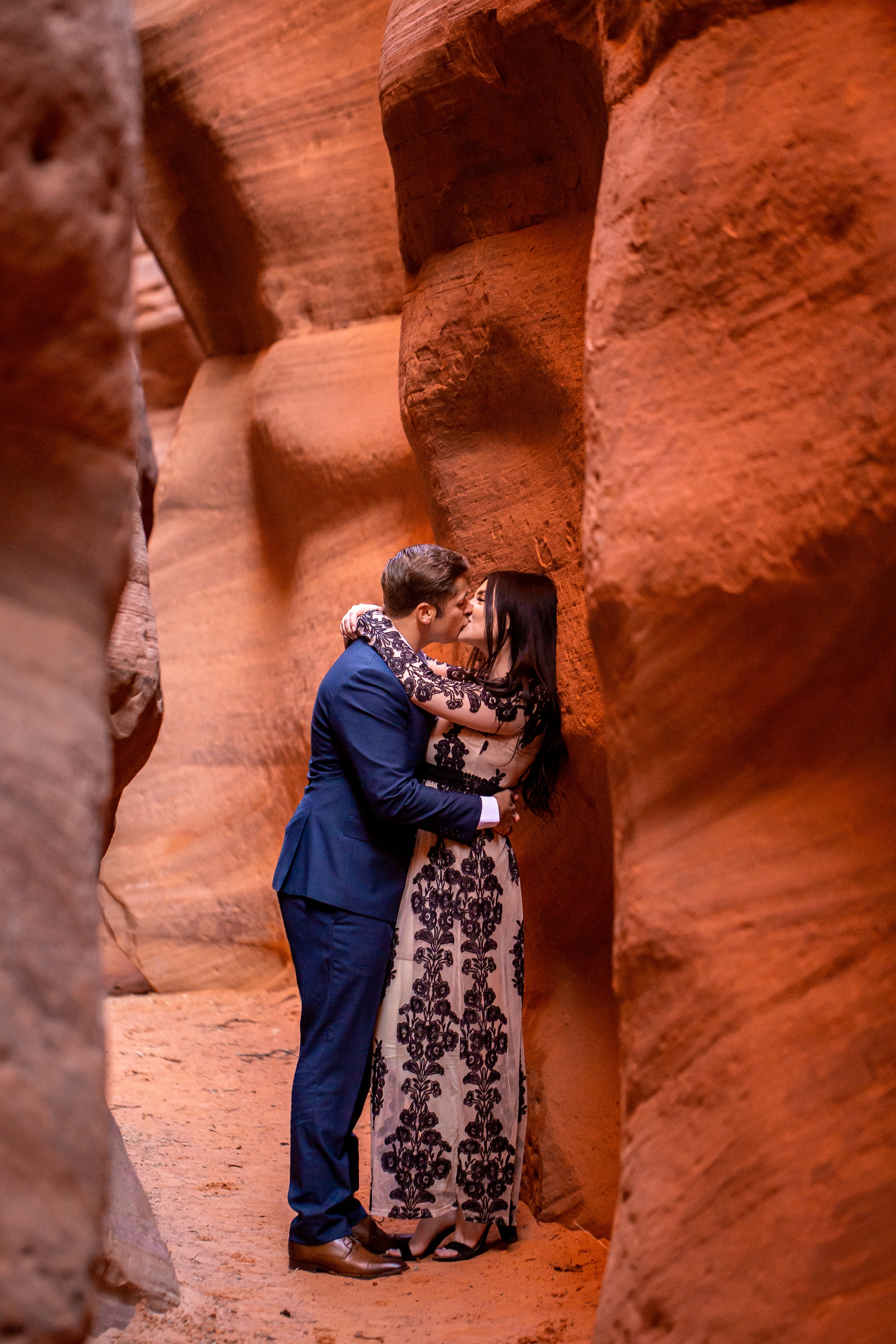 Adventurous engagement session in a Southern Utah slot canyon.