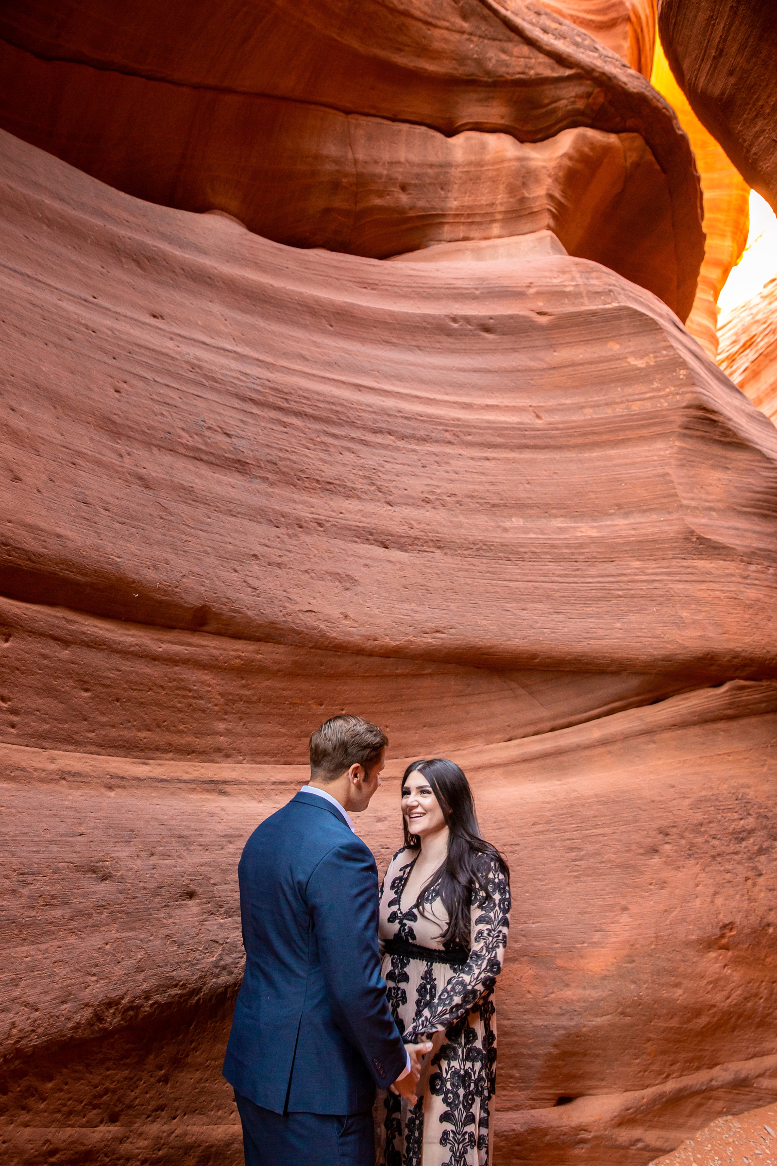 Cute engaged couple in a Utah slot canyon.