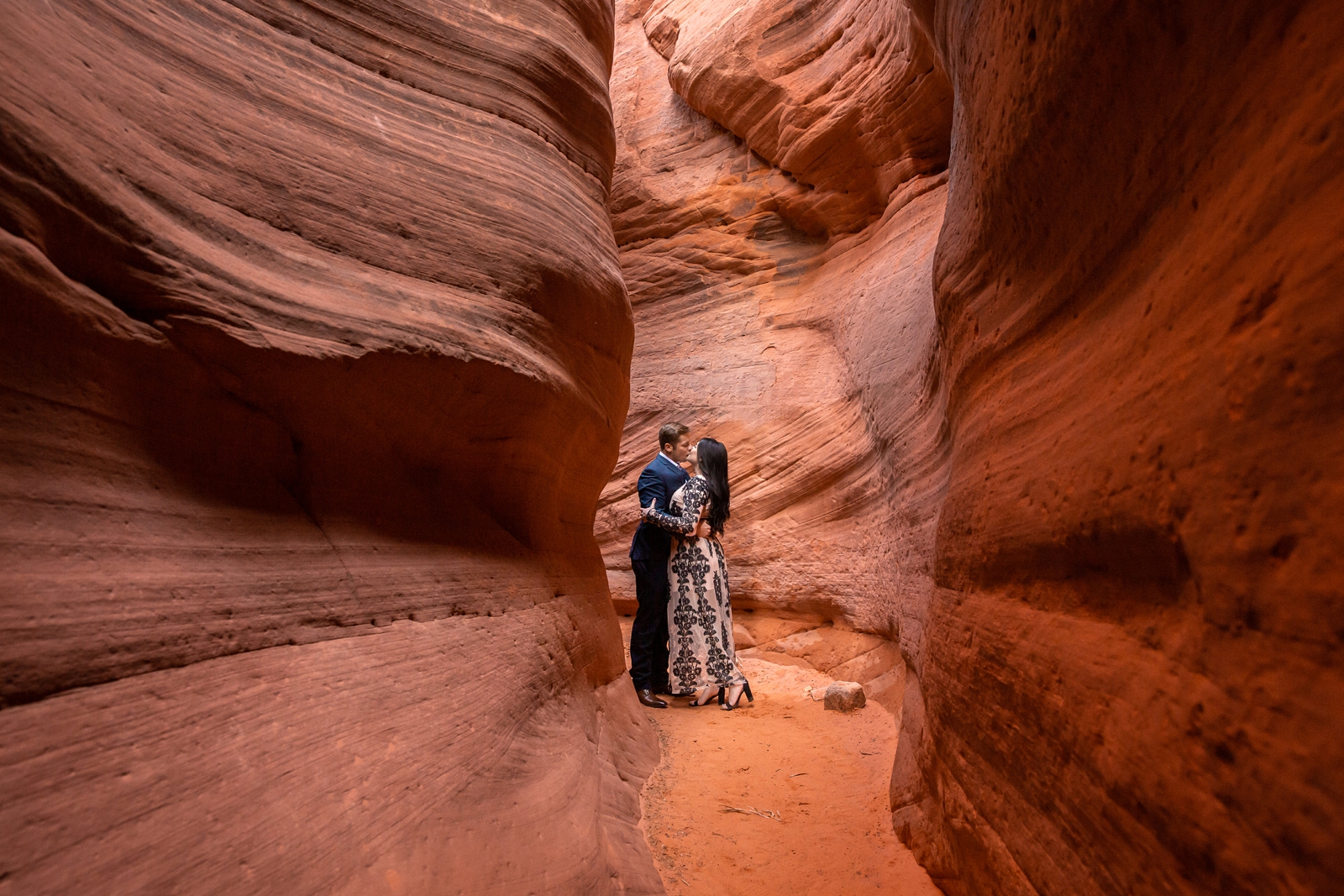 Couple kissing in a Southern UT slot canyon.