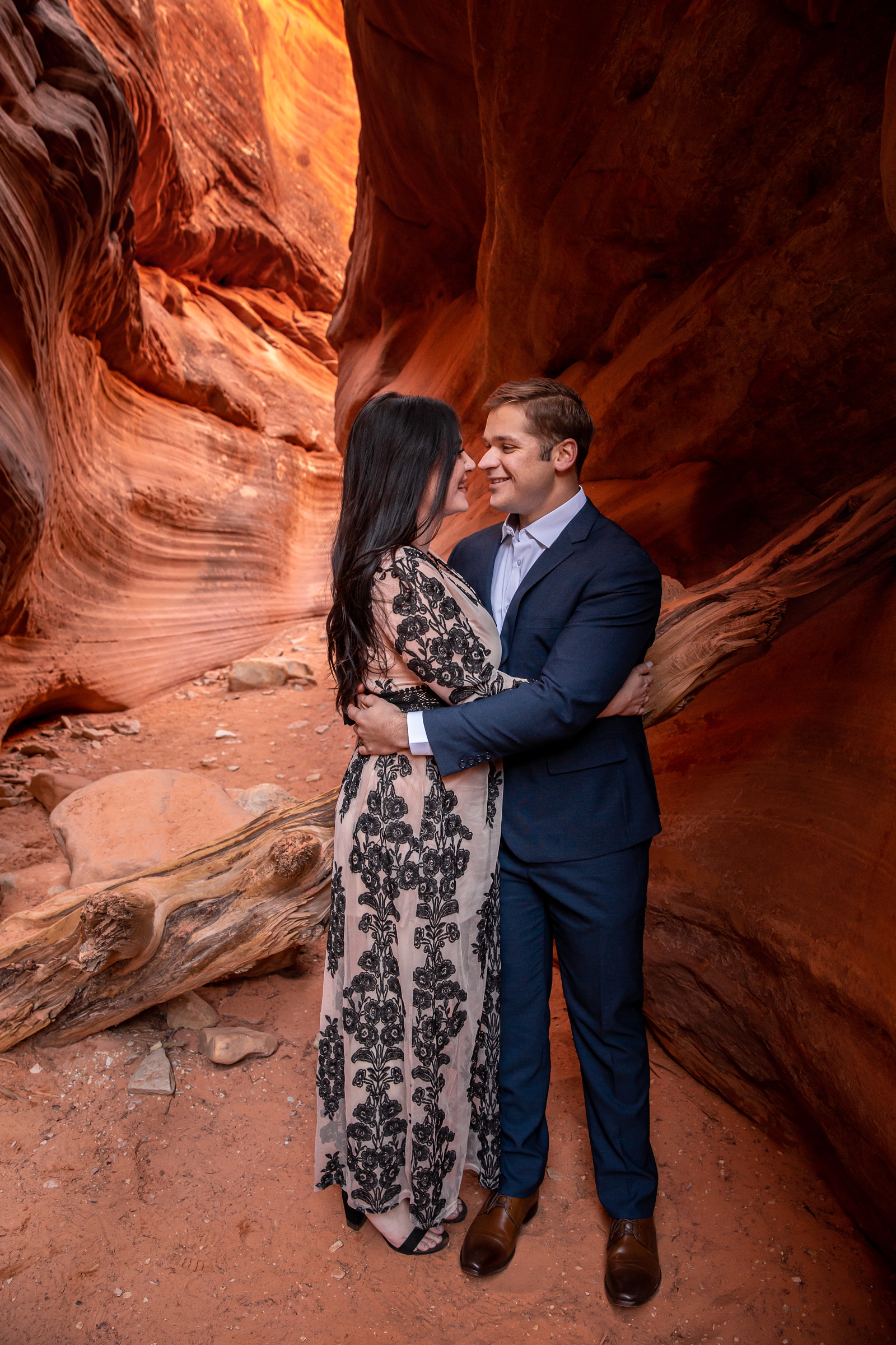 Engaged couple totally in love in a slot canyon.