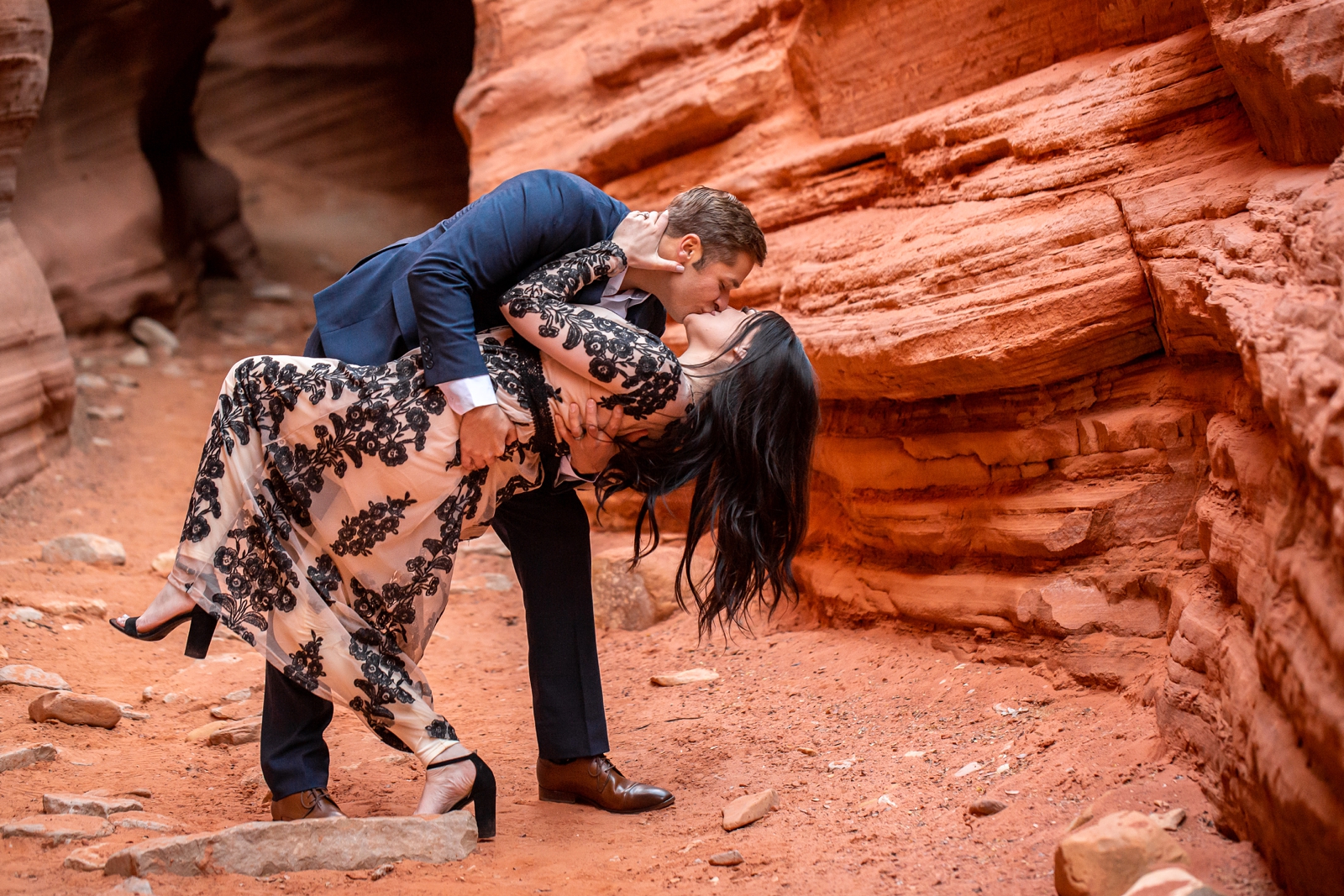 Epic lovers kissing in a slot canyon.