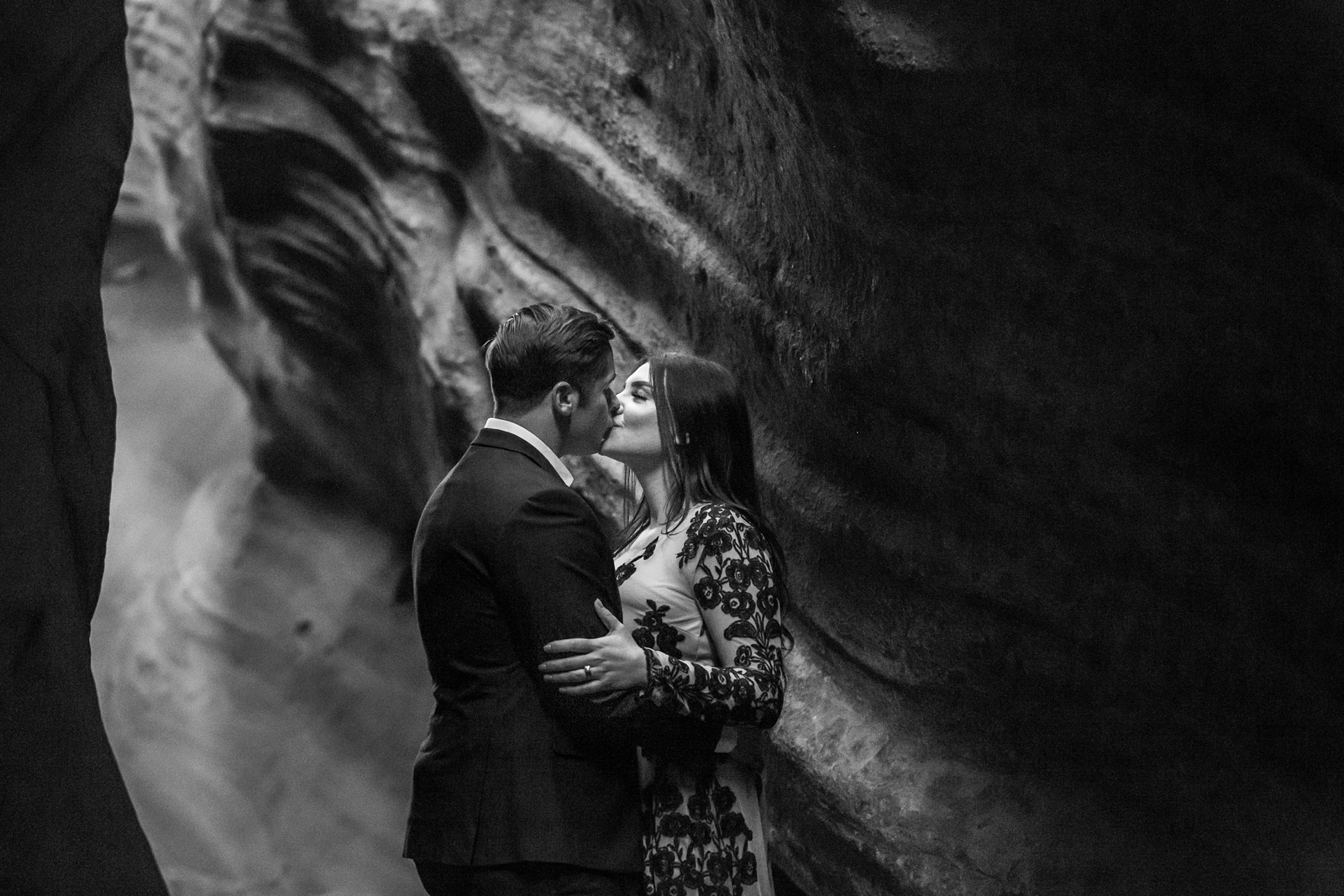 Epic kissing couple in a red rocks Utah slot canyon.