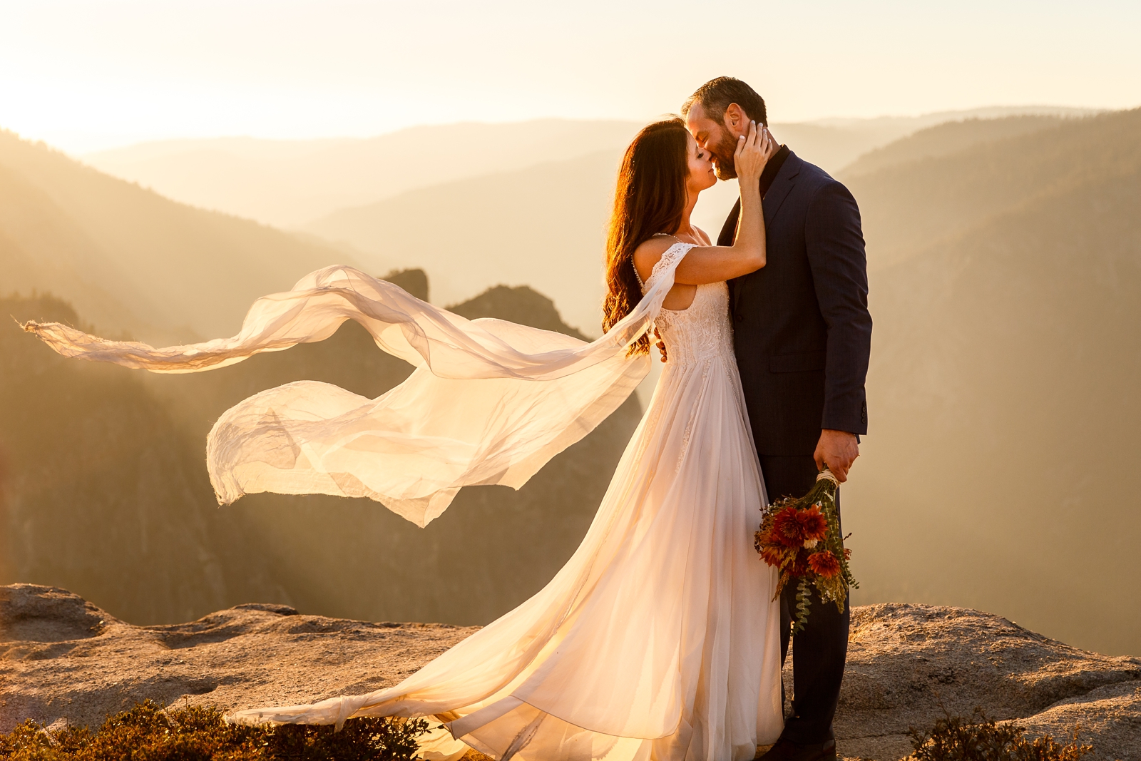 Epic kiss at this couple's adventurous Taft Point sunset elopement.