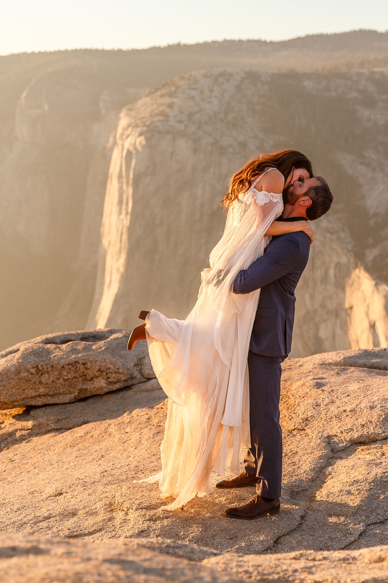 Epic kiss at this couple's adventurous Taft Point golden hour elopement.
