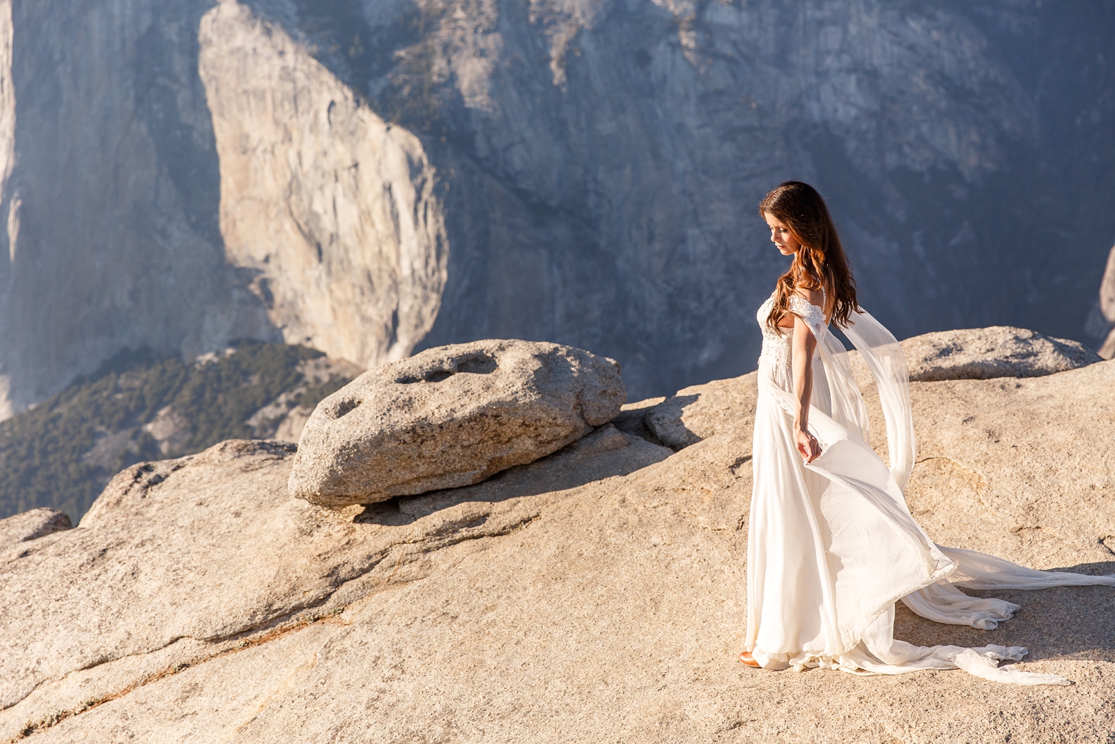 Gorgeous bride on the side of a cliff in Yosemite. 