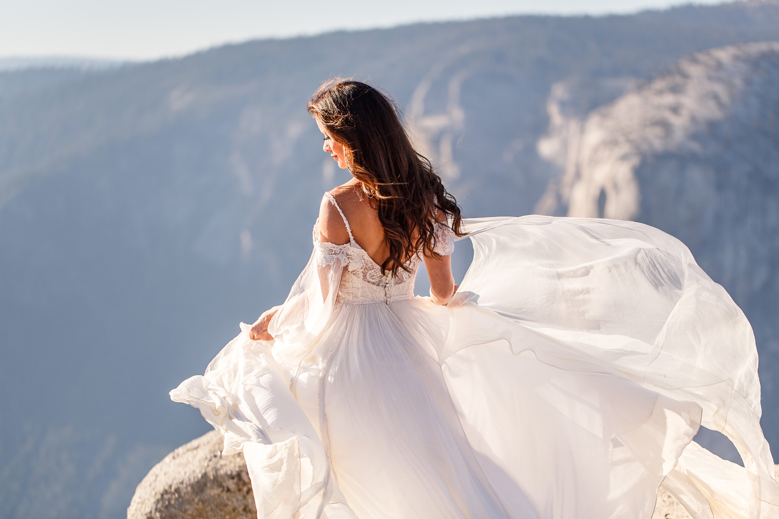 Perfect wind gust in this mountain mermaid bride's dress at Yosemite.