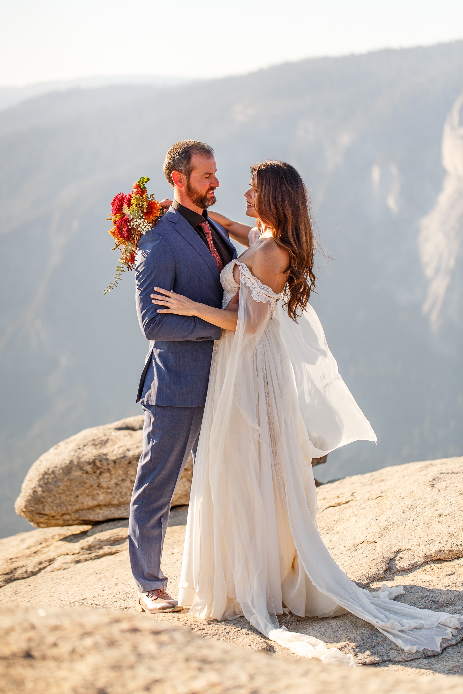 Bride and groom dancing at their cliffside Yosemite elopement.