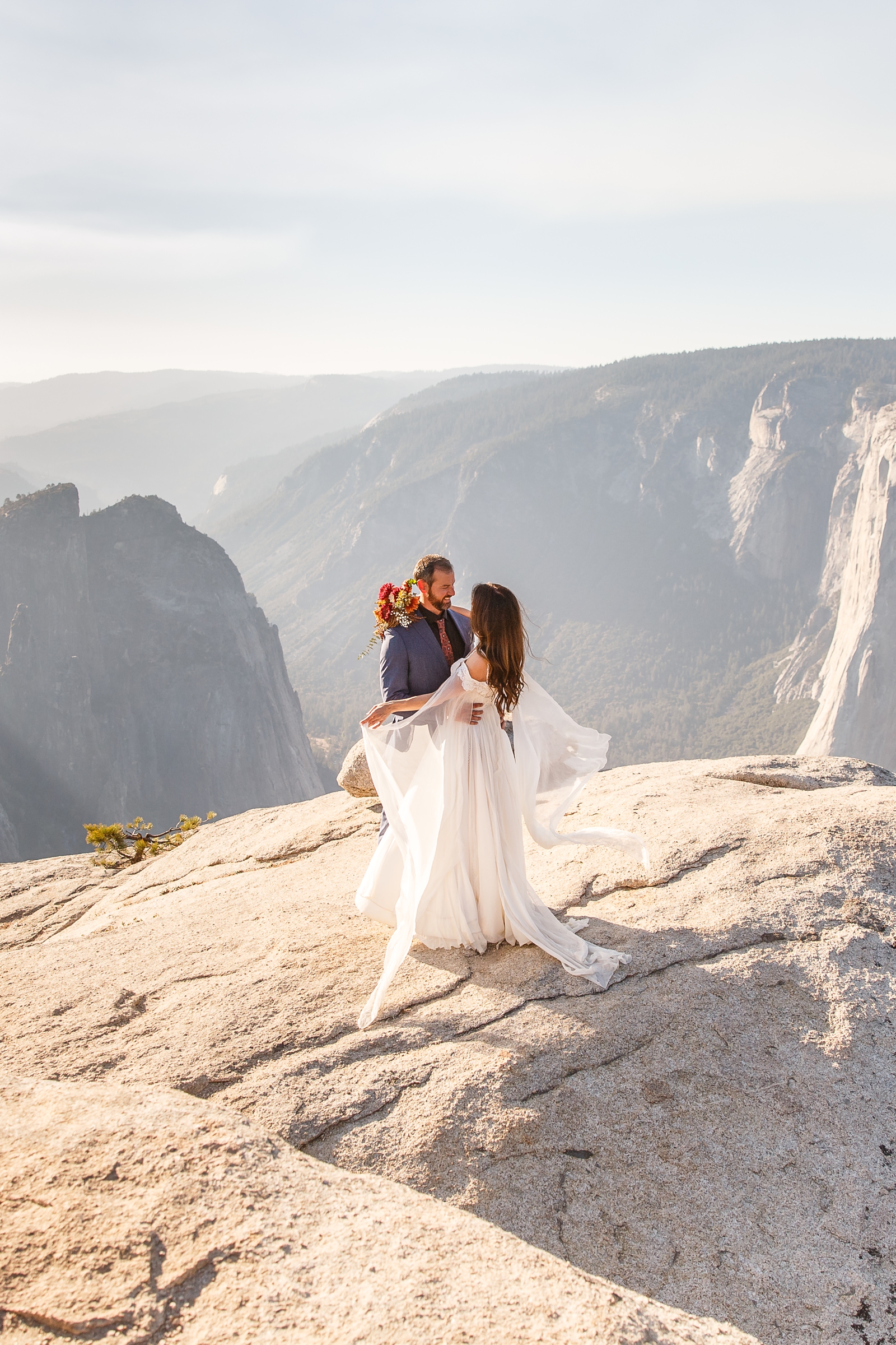 This couple eloped on a windy day at Taft Point in Yosemite. 