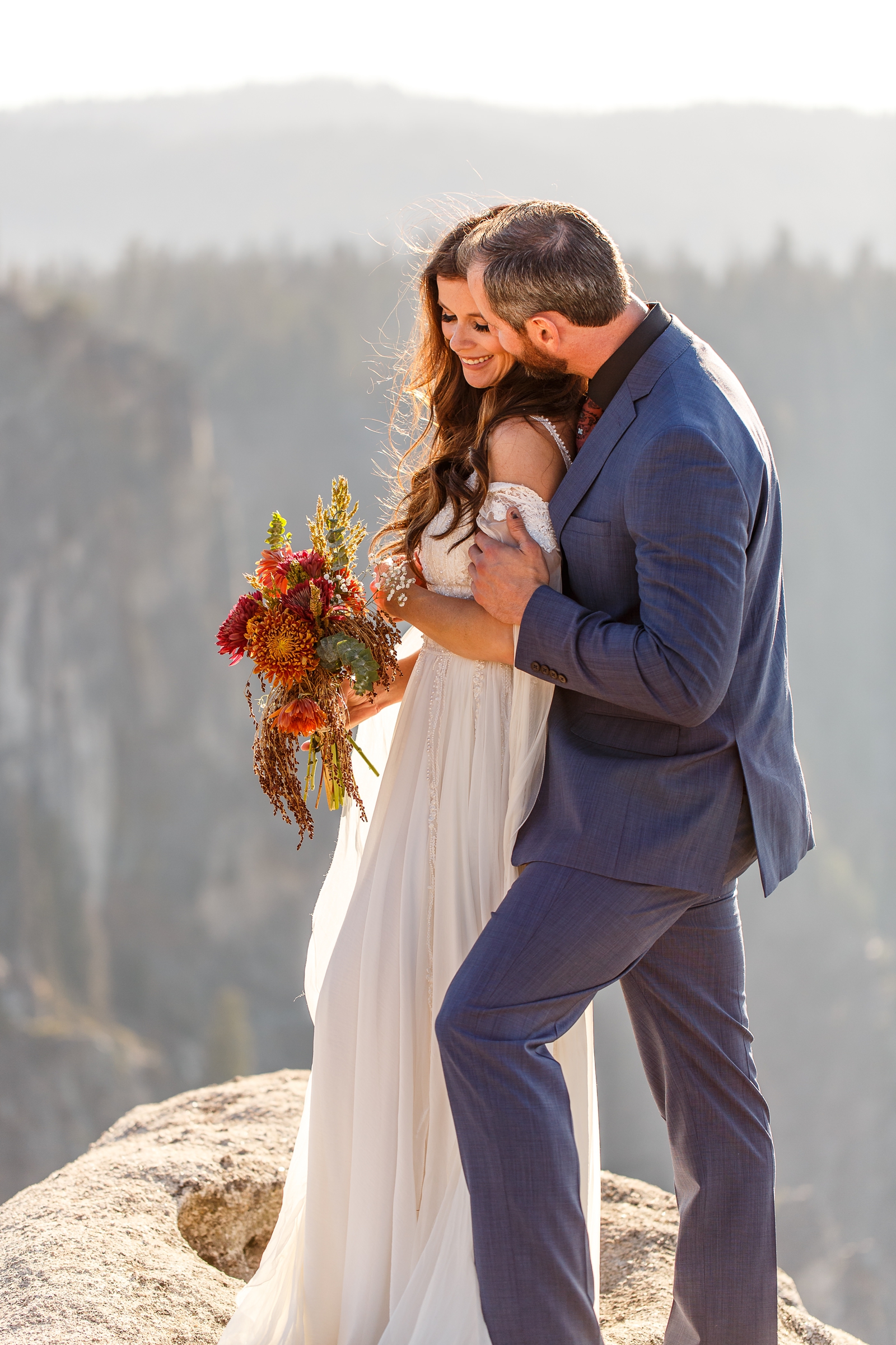 Bride and groom snuggling at their golden hour Yosemite elopement.