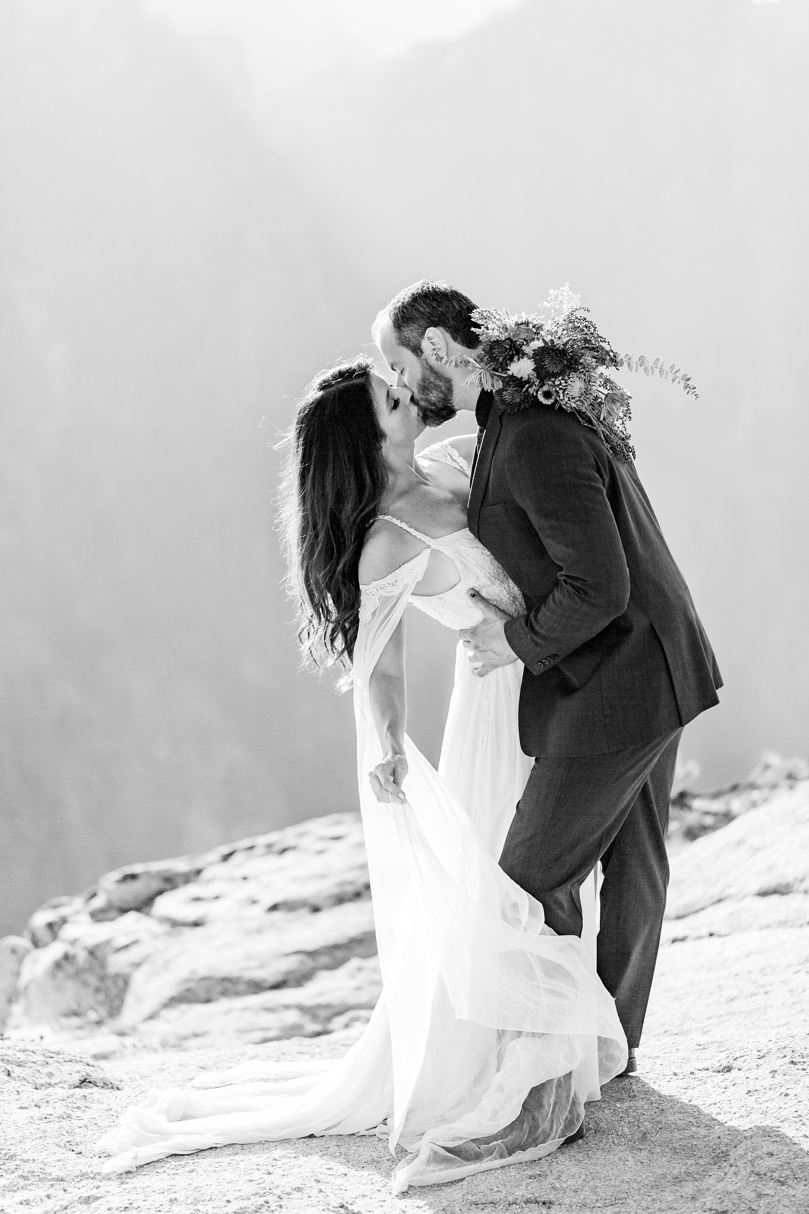 Magically windy kiss at this couple's Yosemite elopement.