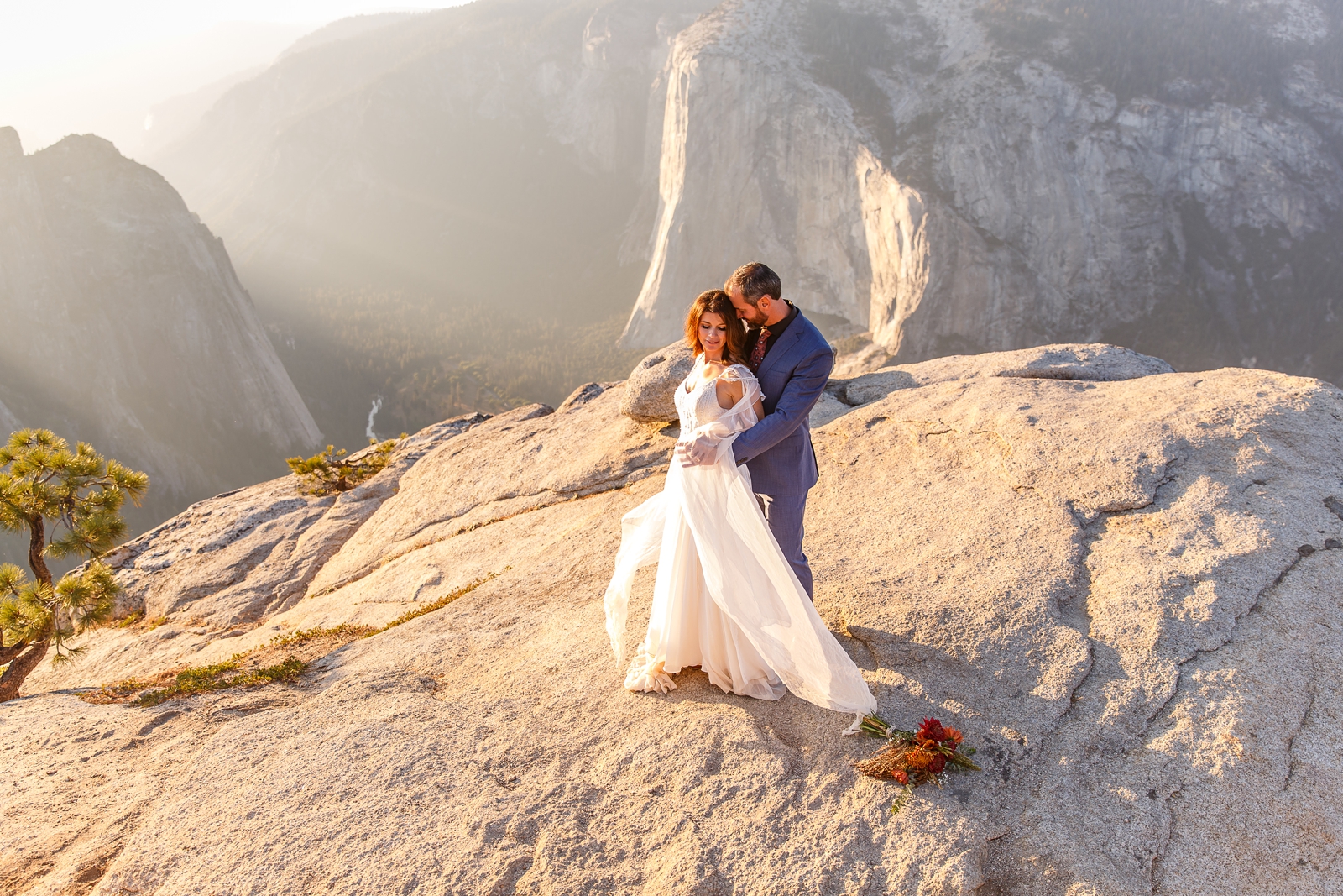 Bride and groom dancing at golden hour in Yosemite NP.