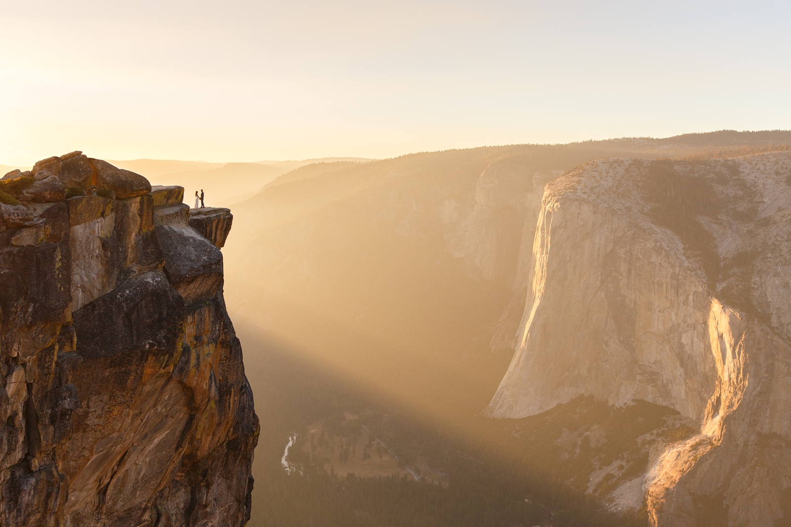 Epic and iconic cliff side sunset elopement at Taft Point Yosemite.