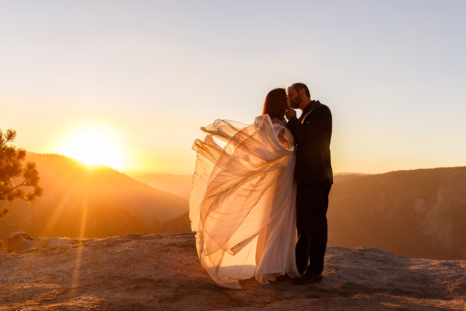 Fairytale like kiss at this bride and groom's Yosemite sunset elopement.