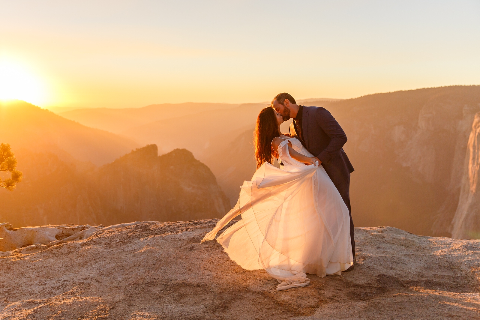 Dreamy sunset kiss at this couple's Taft Point Yosemite elopement.