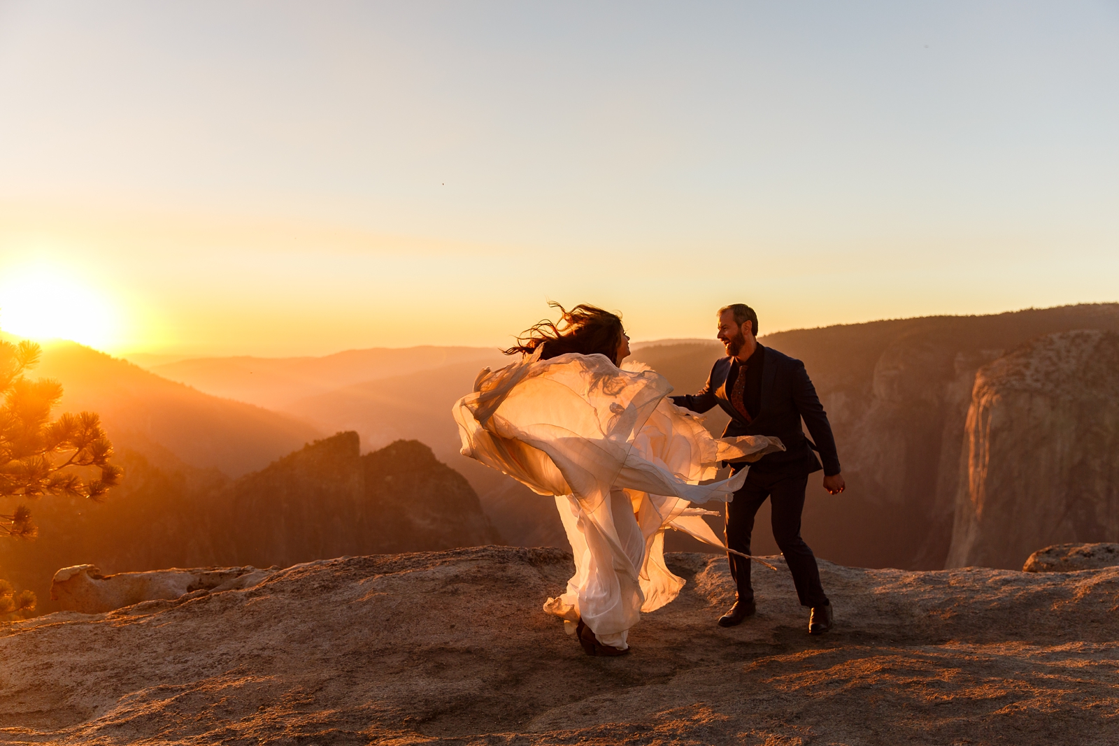 Bride and groom jumping for joy on their wedding day in Yosemite NP.
