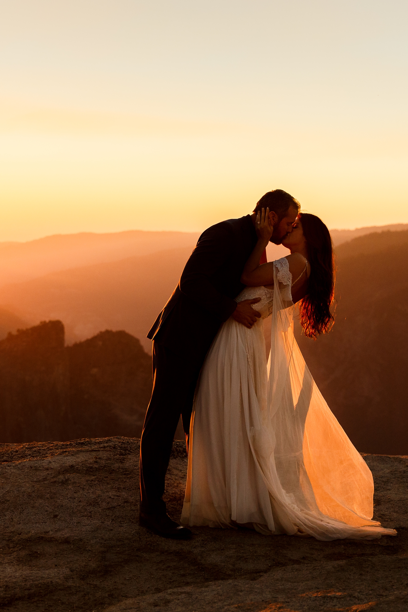 This eloping couple shared their first kiss at sunset in Yosemite. 