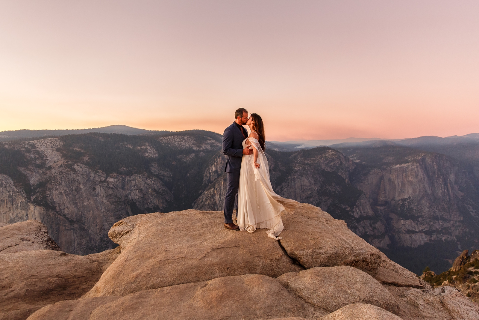 Mountain mermaid bride and groom at their Taft Point sunset elopement in Yosemite.