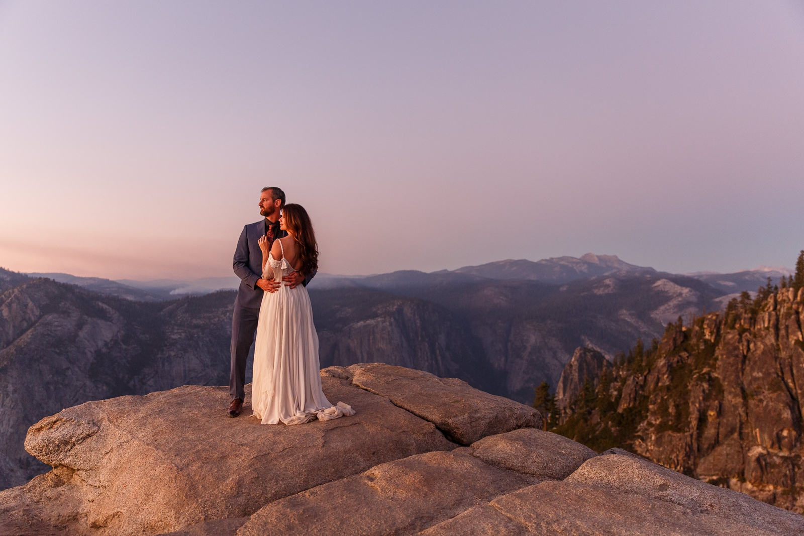 Romantic pink hour Taft Point elopement in Yosemite.