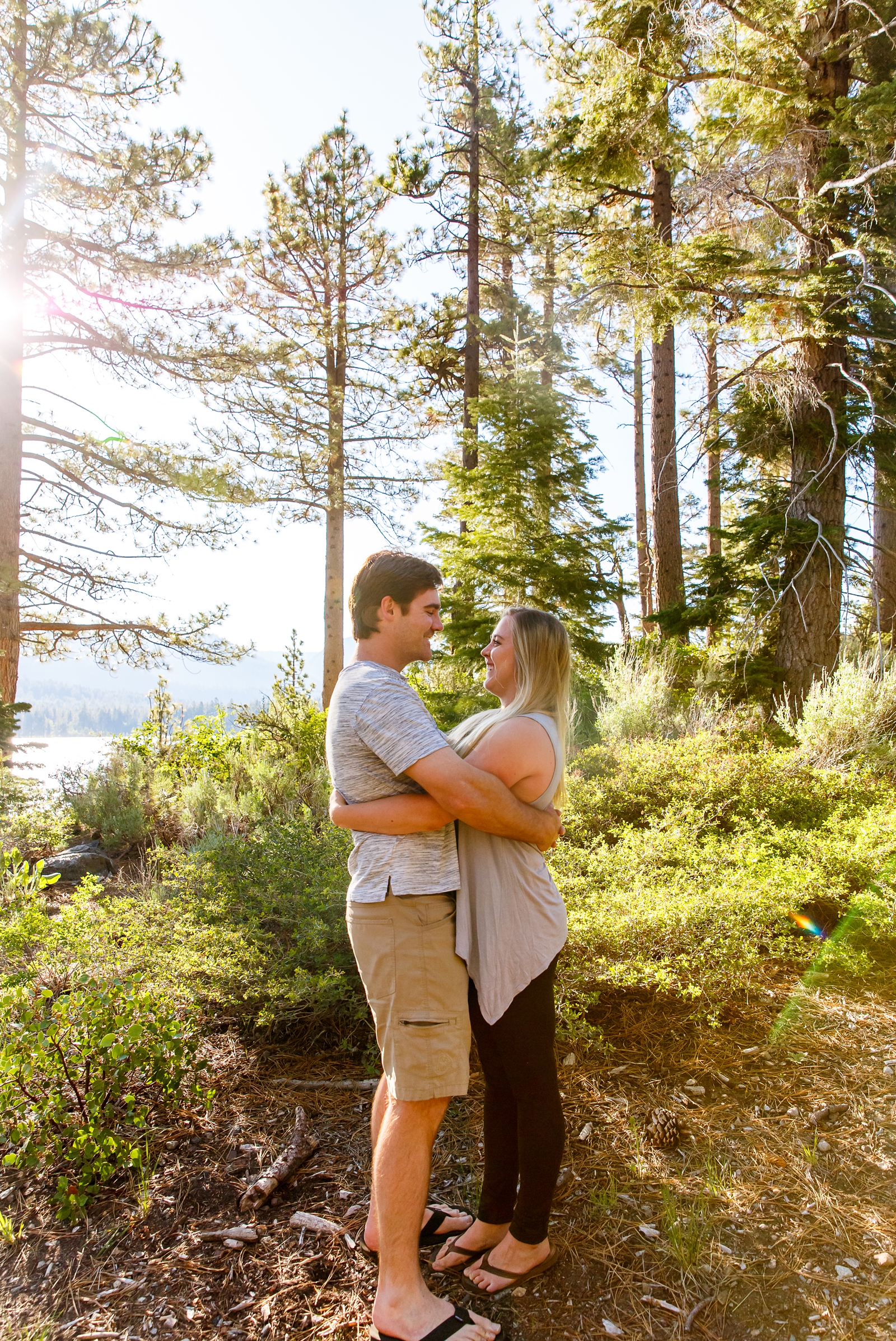 a couple embracing each other by Lake Tahoe for their adventure session