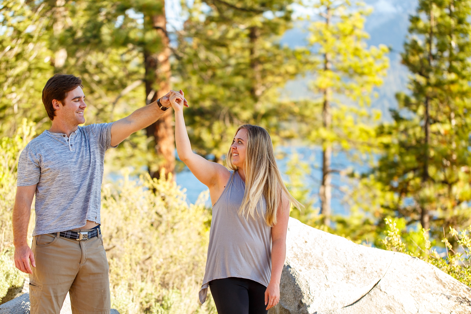 a couple holding hands by Lake Tahoe for their adventure session