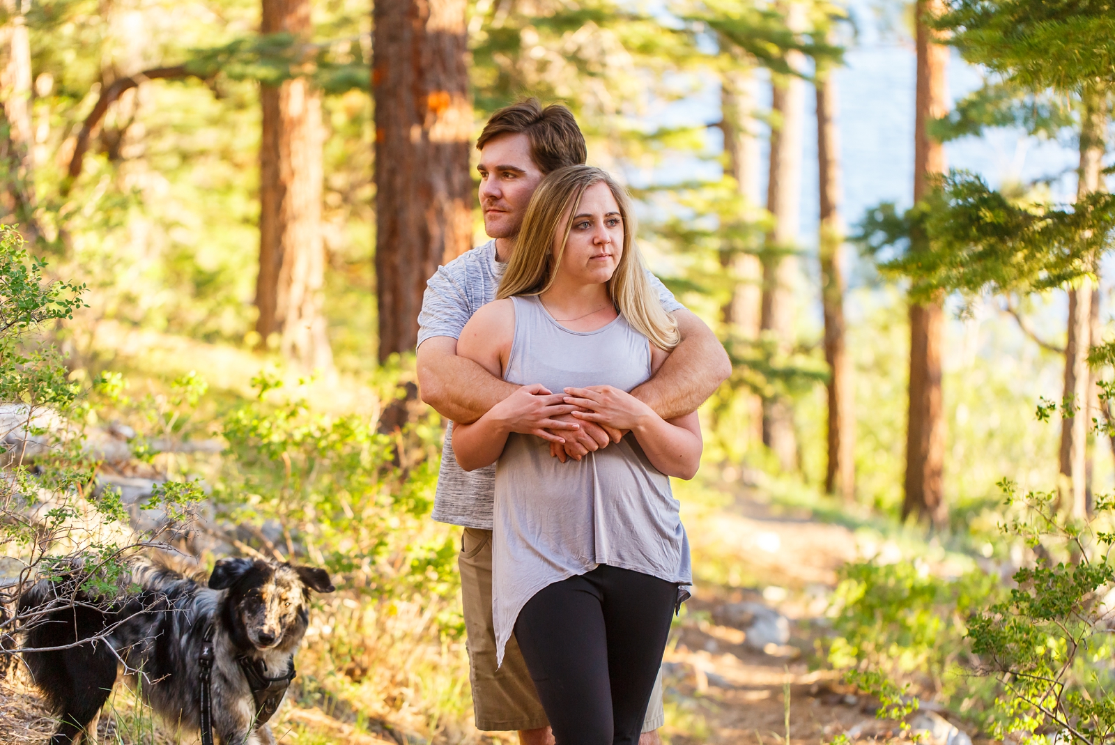 a couple embracing looking opposite directions during their Lake Tahoe adventure session