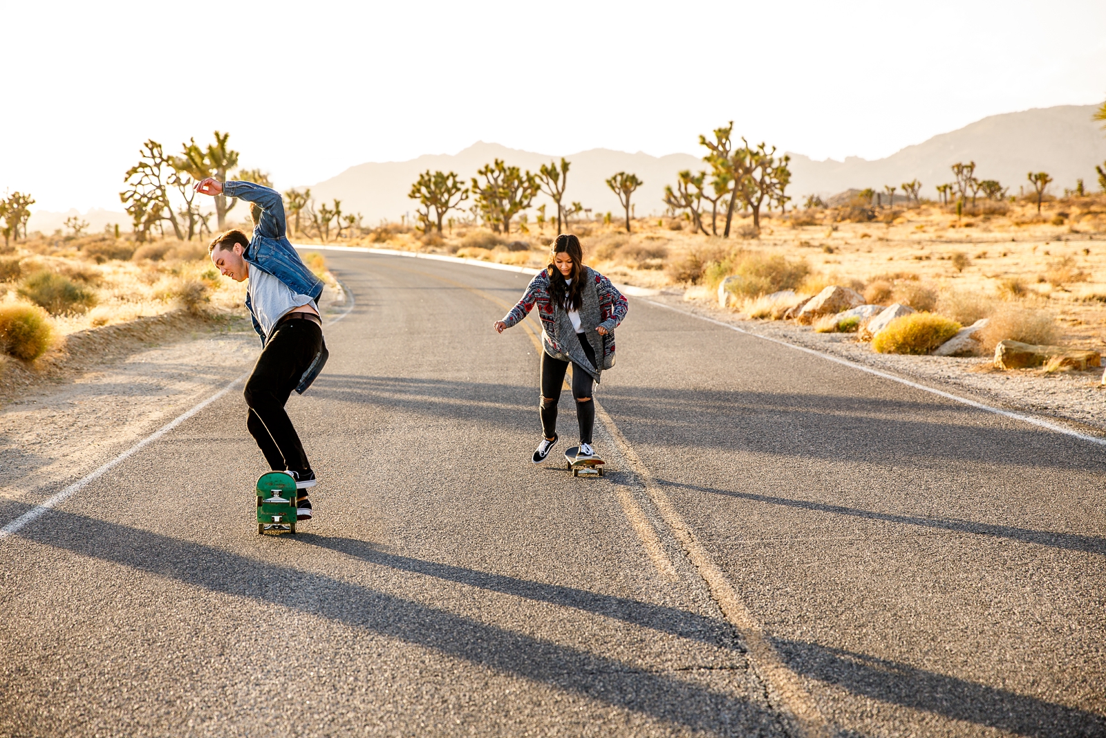 This engaged couple skateboarded in Joshua Tree NP at golden hour. 