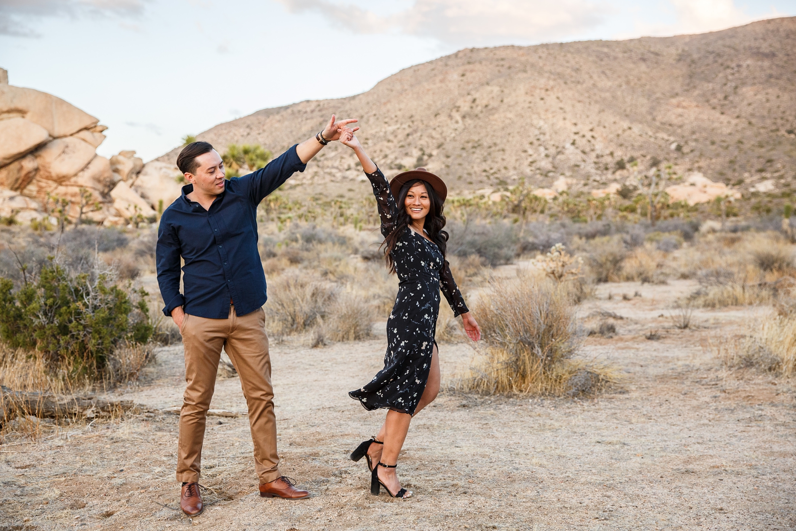 Dancing engaged couple at their Joshua Tree engagement session.