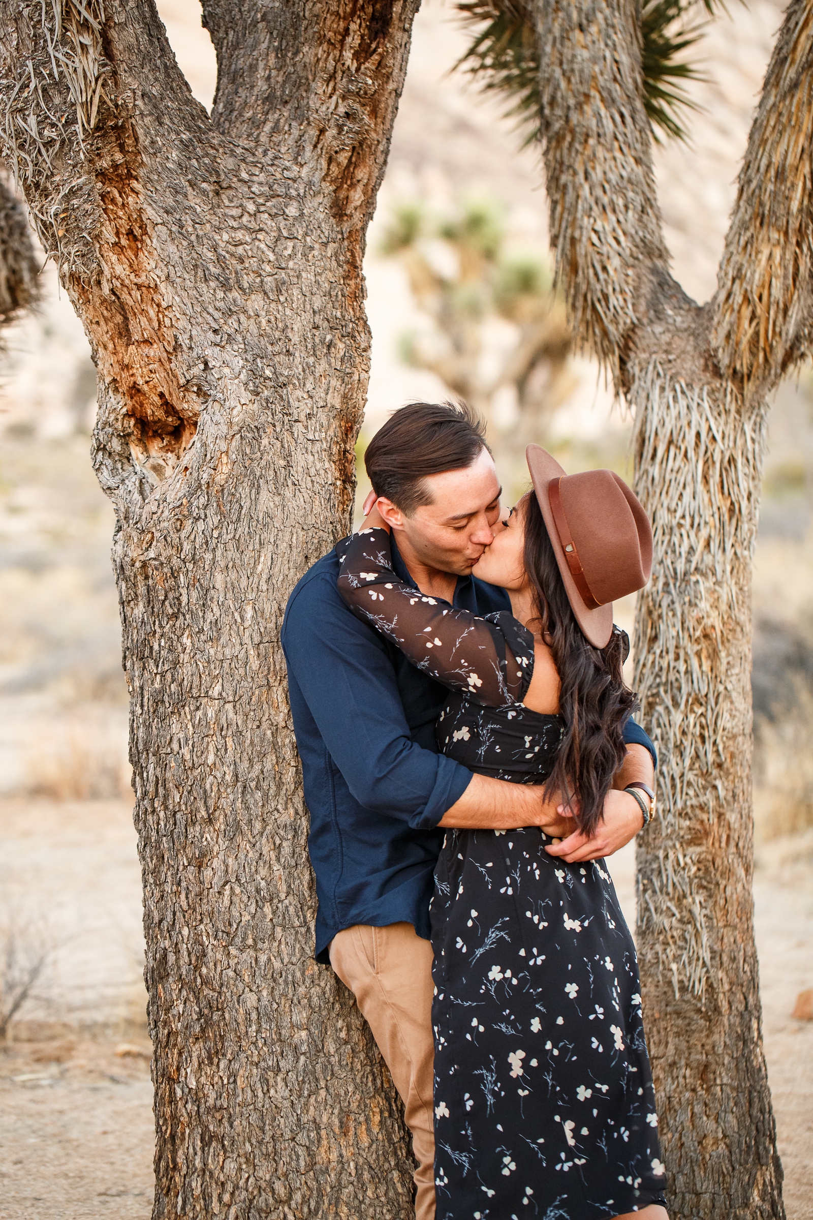 Tender kiss at this couple's Joshua Tree engagement session