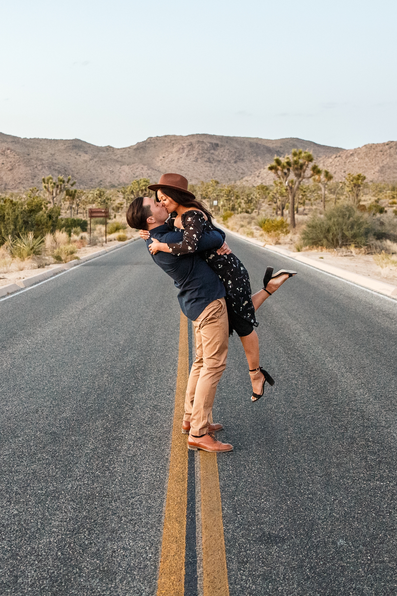 Engaged couple kissing in Joshua Tree NP.