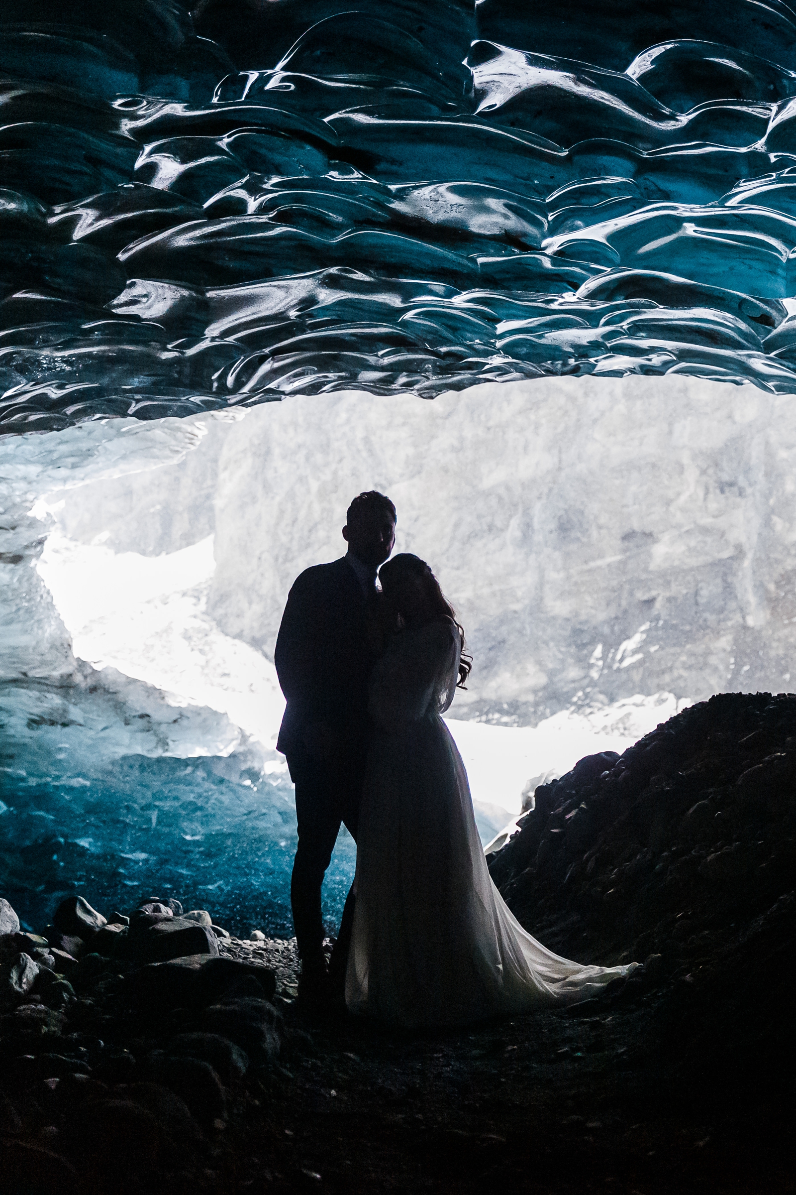 A bride and groom cuddle up during their winter Iceland elopement.