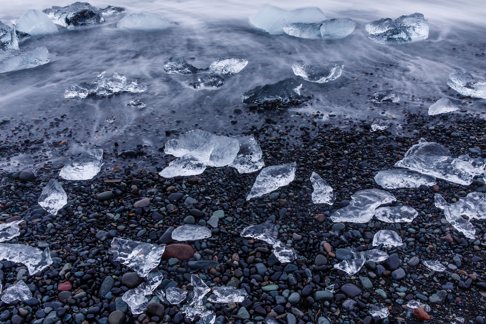 Glacier ice on black sand Diamond Beach in Southern Iceland.