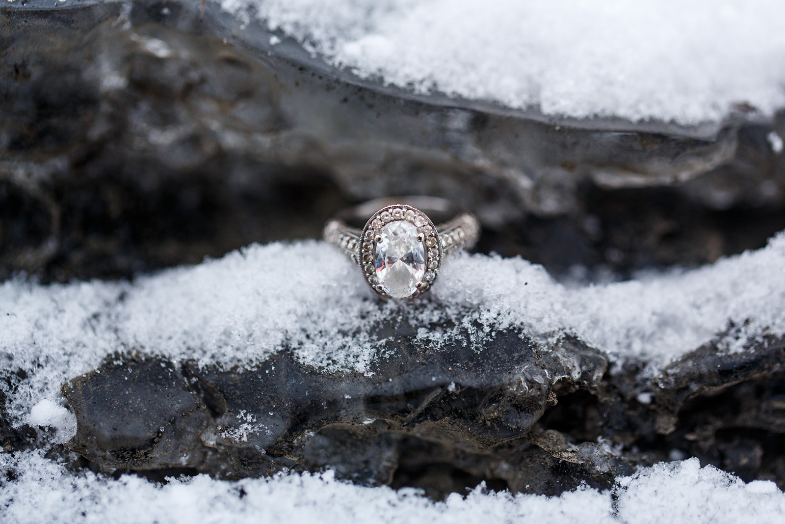 A huge diamond engagement ring in the snow if an Iceland ice cave.