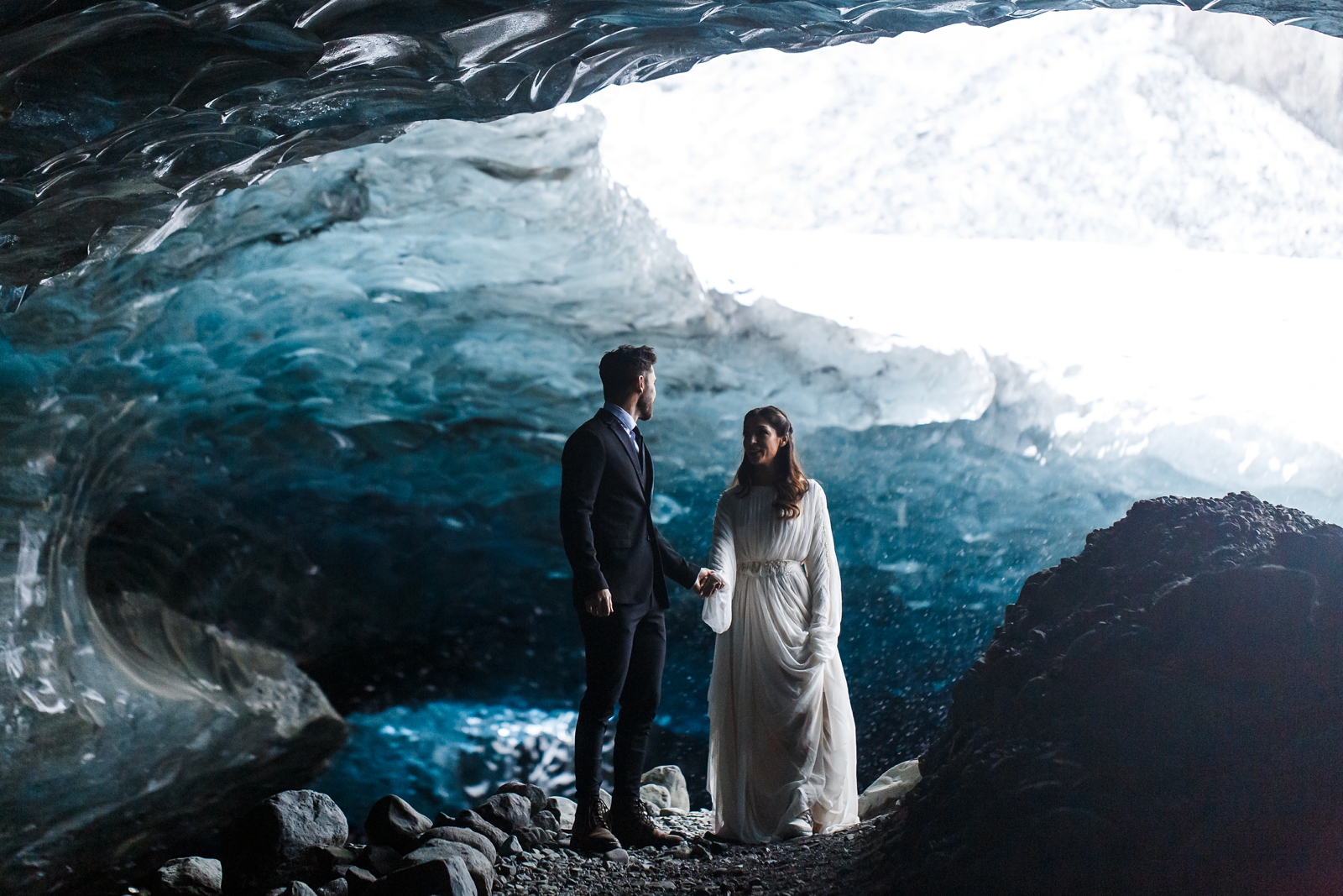 An eloping bride and groom in a beautiful Iceland glacier cave.