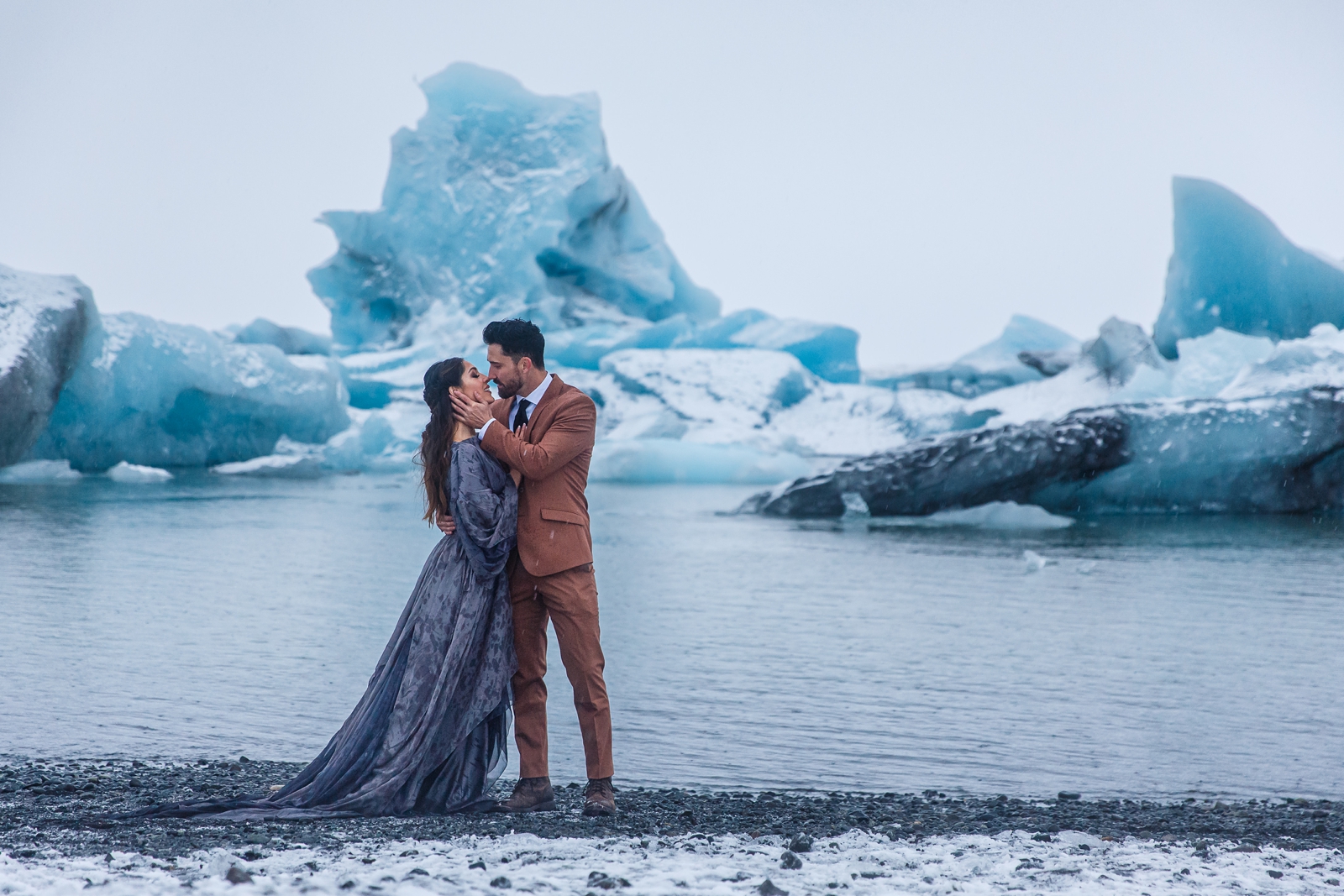 This eloping couple wore nontraditional clothes at their Jökulsárlón Iceland elopement.