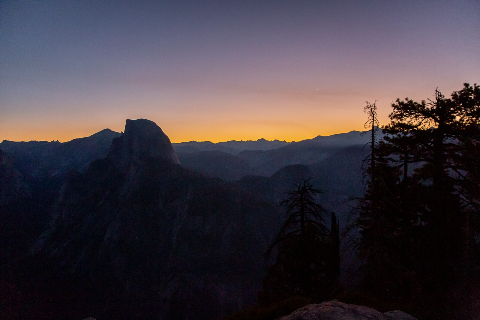 Sunrise over Half Dome in Yosemite during a Glacier Point elopement.