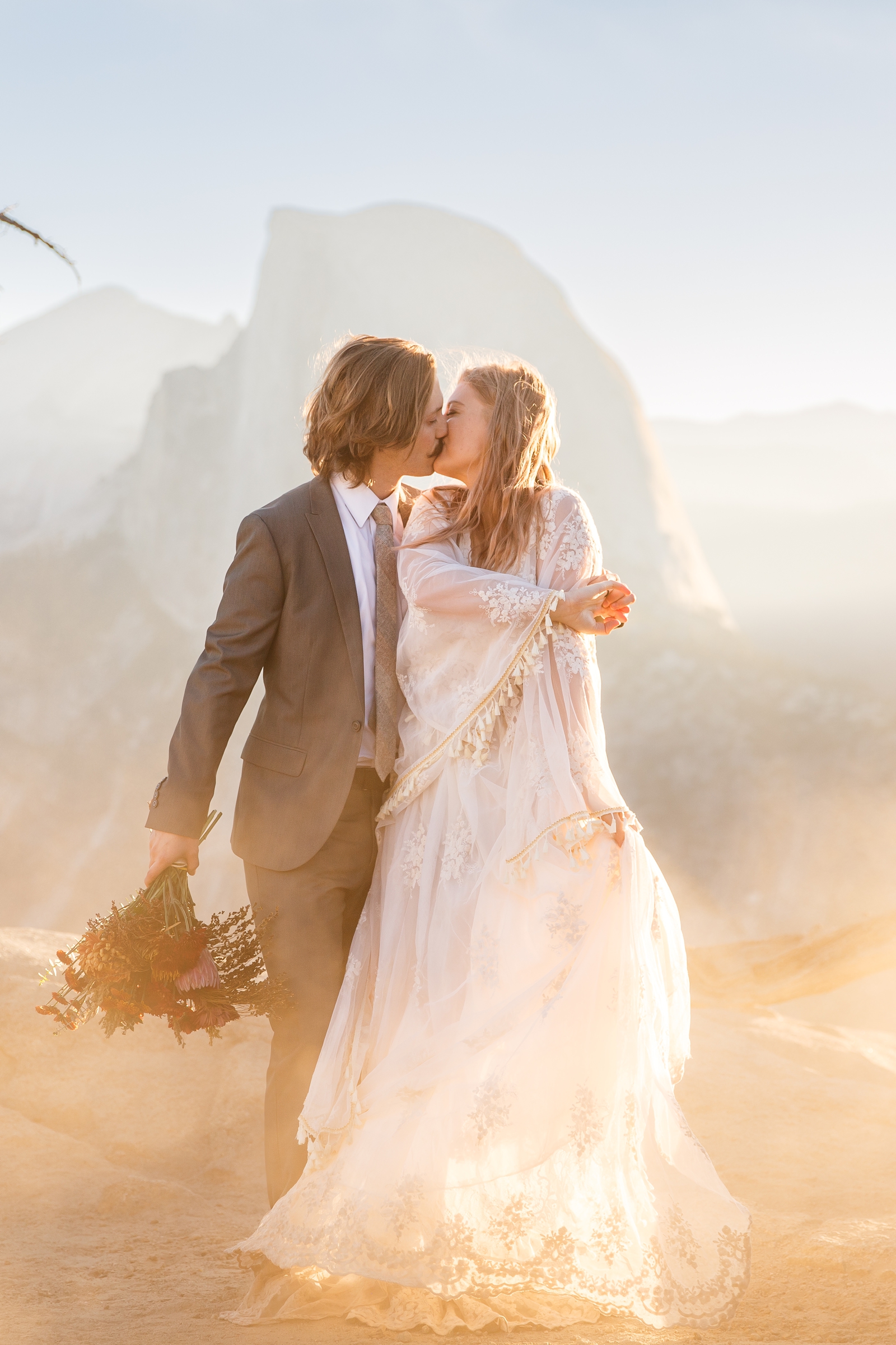 Misty golden hour kisses at this couple's Yosemite Glacier Point elopement.