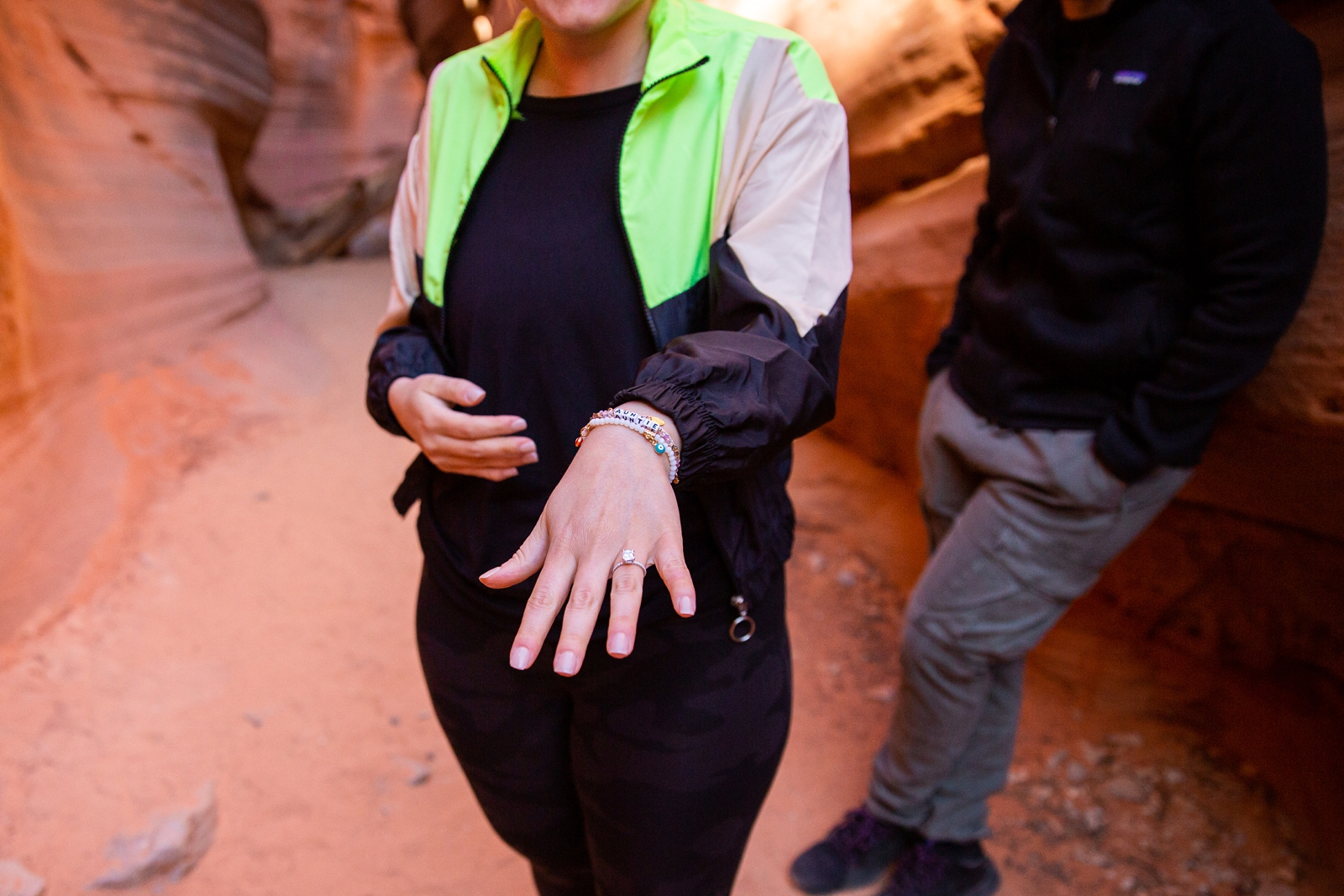 A newly engaged woman showing off her new engagement ring in the Antelope Slot Canyon